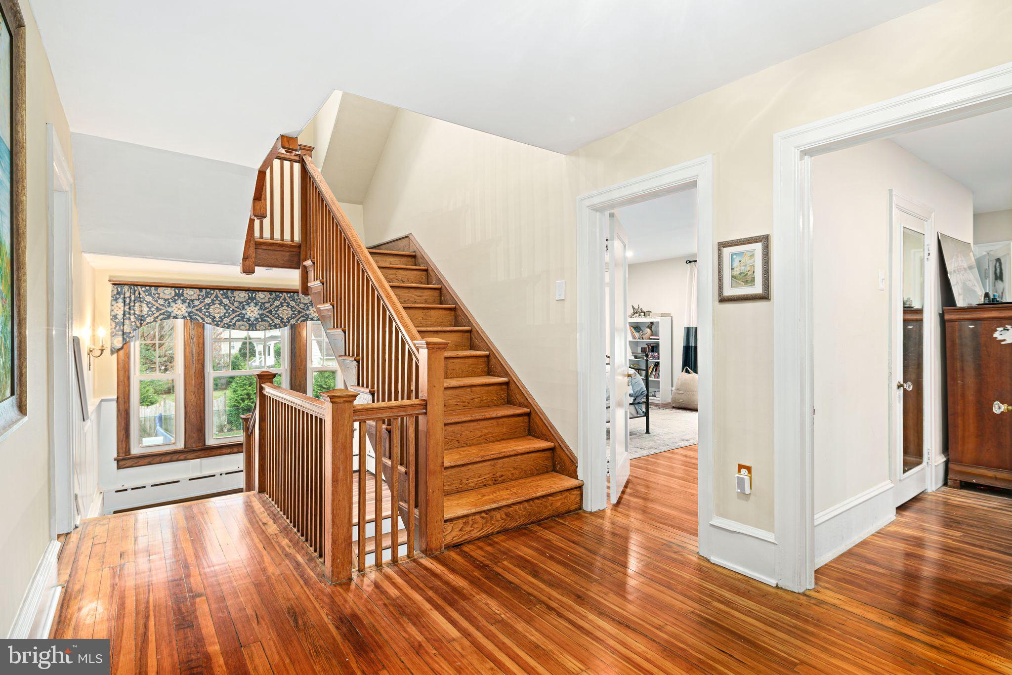 311 Chews Landing Road Haddonfield, NJ 08033 - Photo 19 of 31 a view of front door with hallway and wooden floor