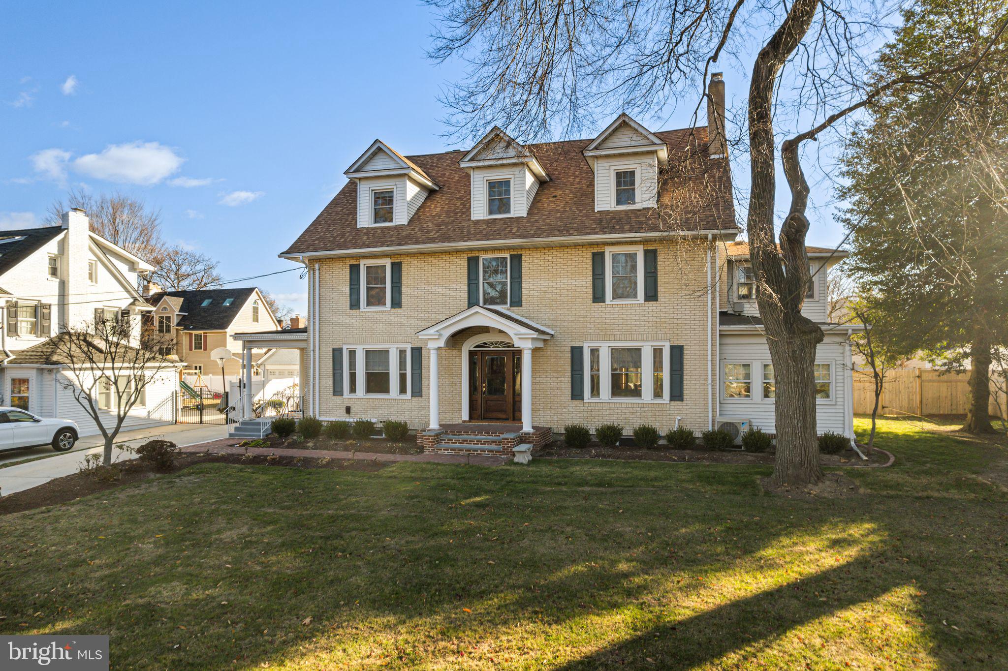 311 Chews Landing Road Haddonfield, NJ 08033 - Photo 2 of 31 a front view of a house with garden