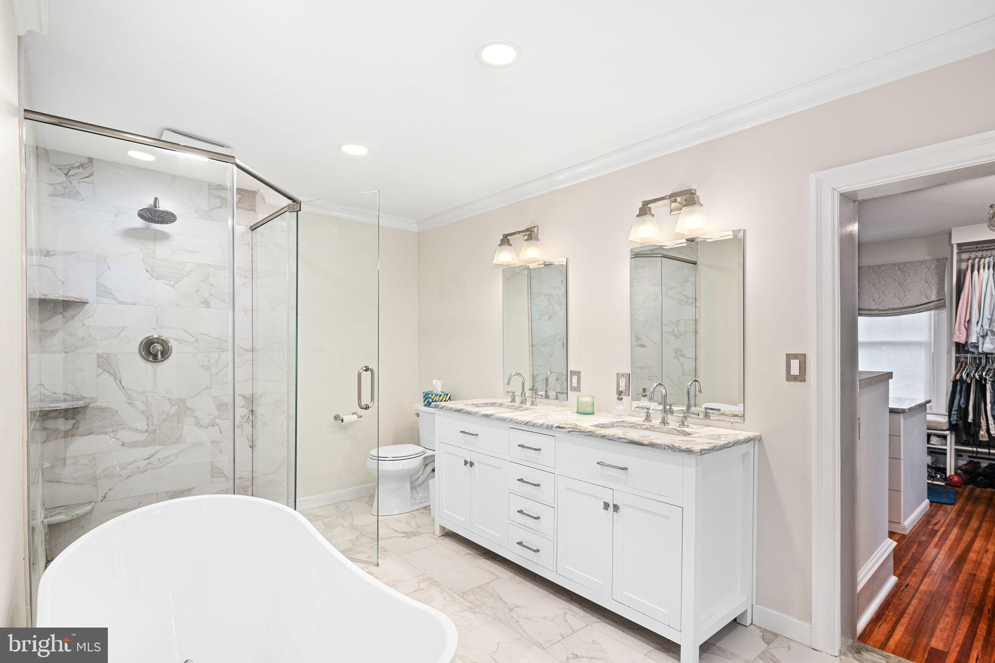311 Chews Landing Road Haddonfield, NJ 08033 - Photo 21 of 31 a spacious bathroom with double vanity sinks a mirror and a shower