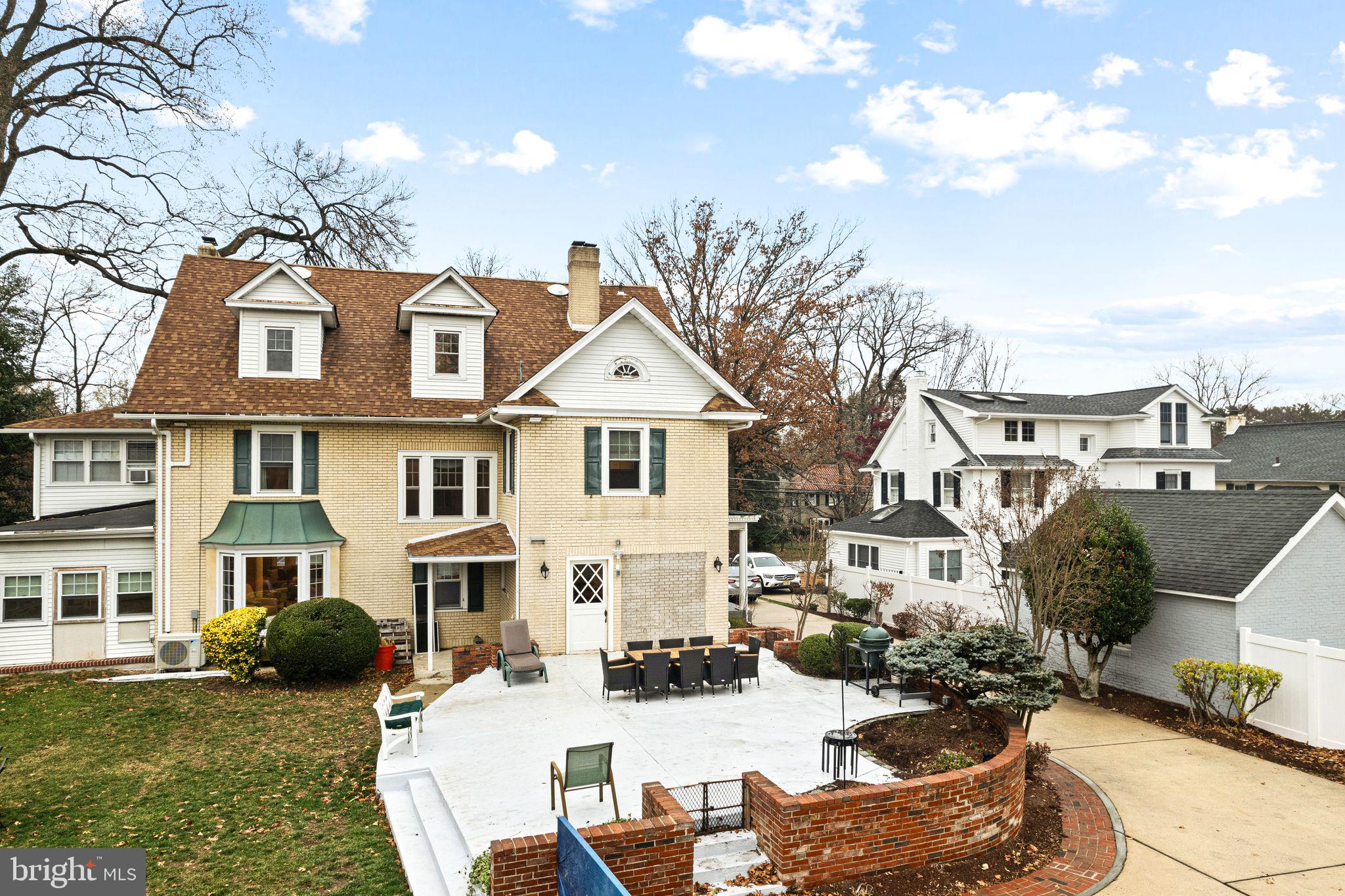 311 Chews Landing Road Haddonfield, NJ 08033 - Photo 6 of 31 a view of a white building with many windows and yard