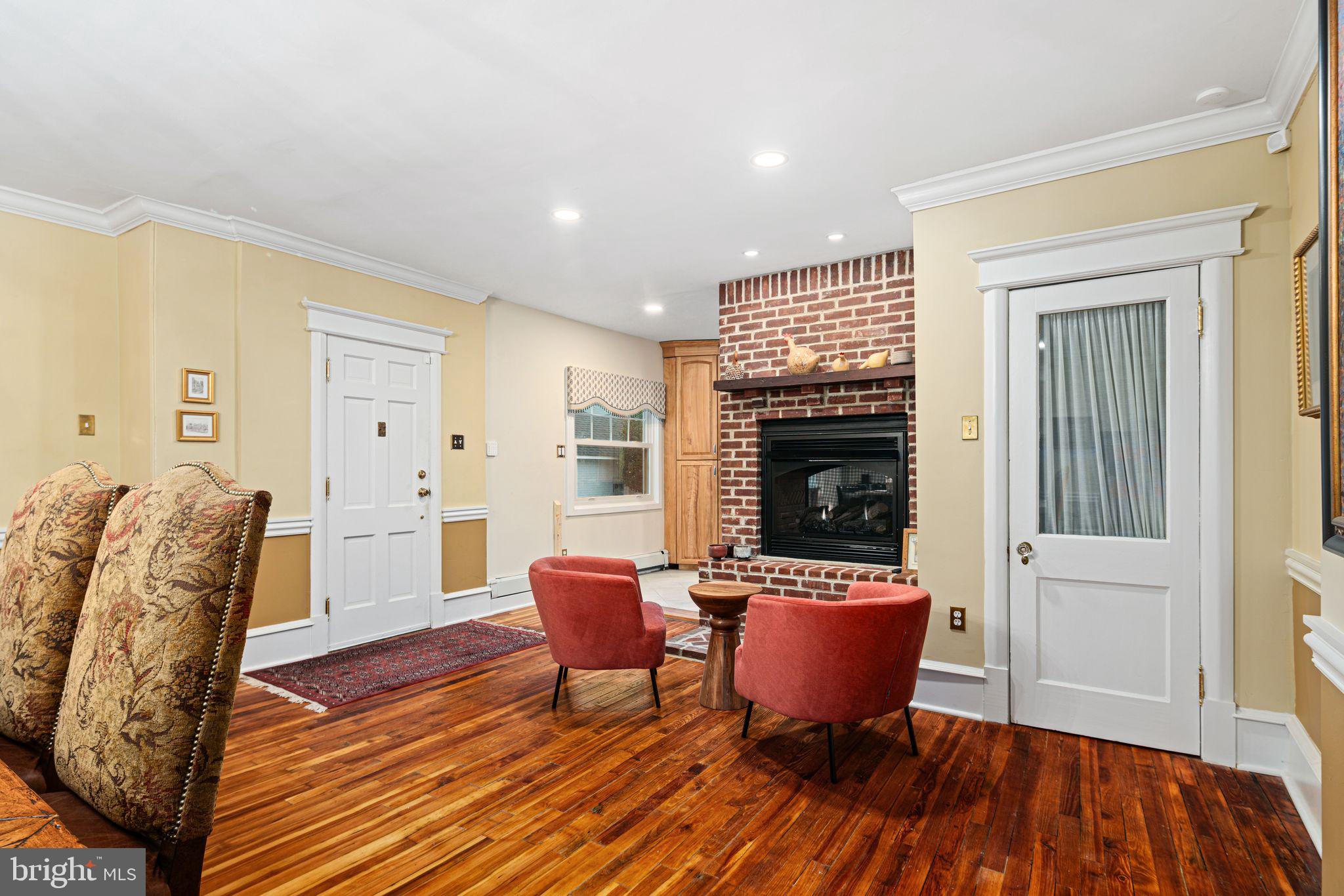 311 Chews Landing Road Haddonfield, NJ 08033 - Photo 10 of 31 a living room with furniture wooden floor and a fireplace
