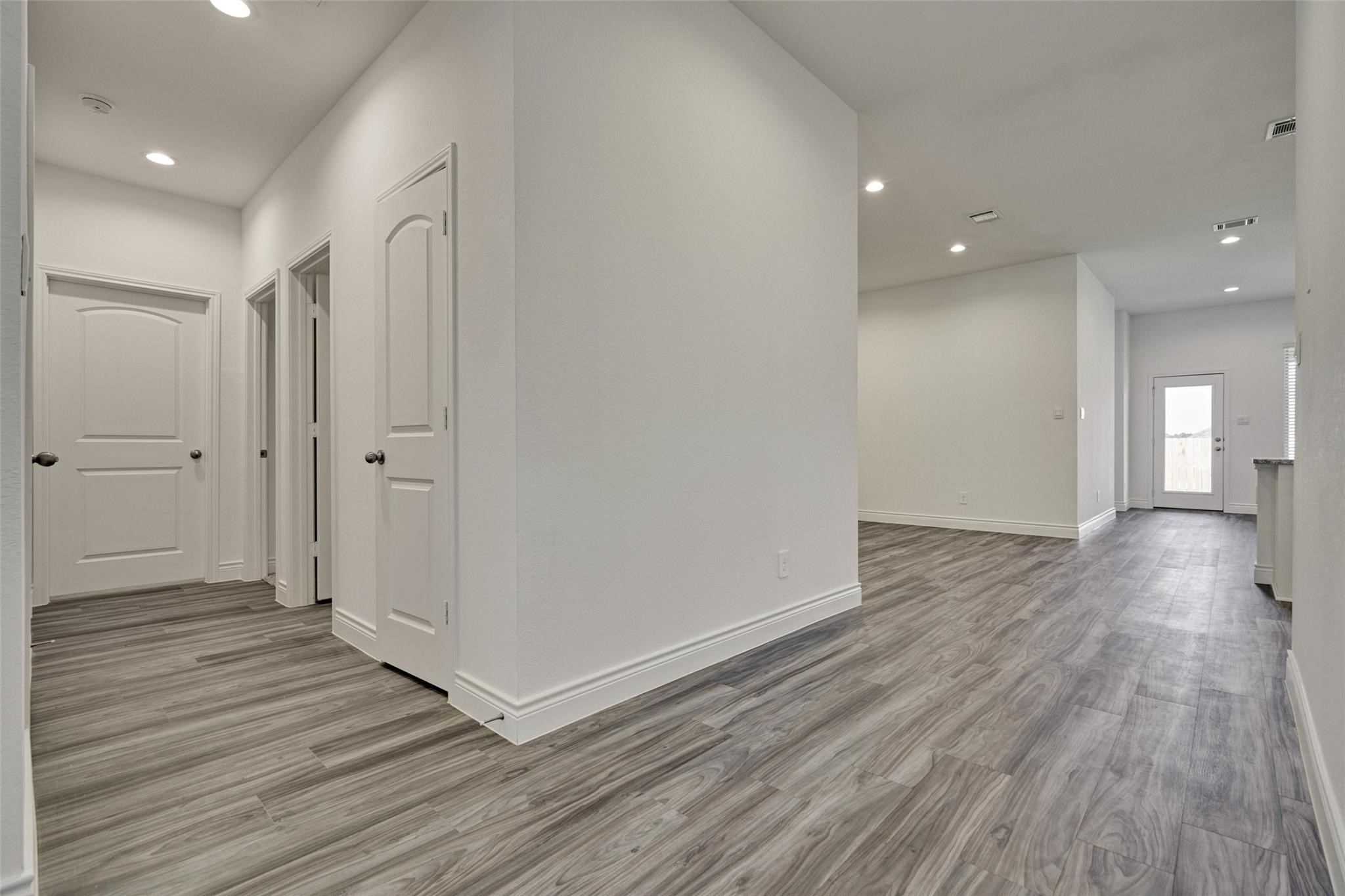 981 Youth Water Road Montgomery, TX 77316 - Photo 10 of 43 a view of a hallway with wooden floor