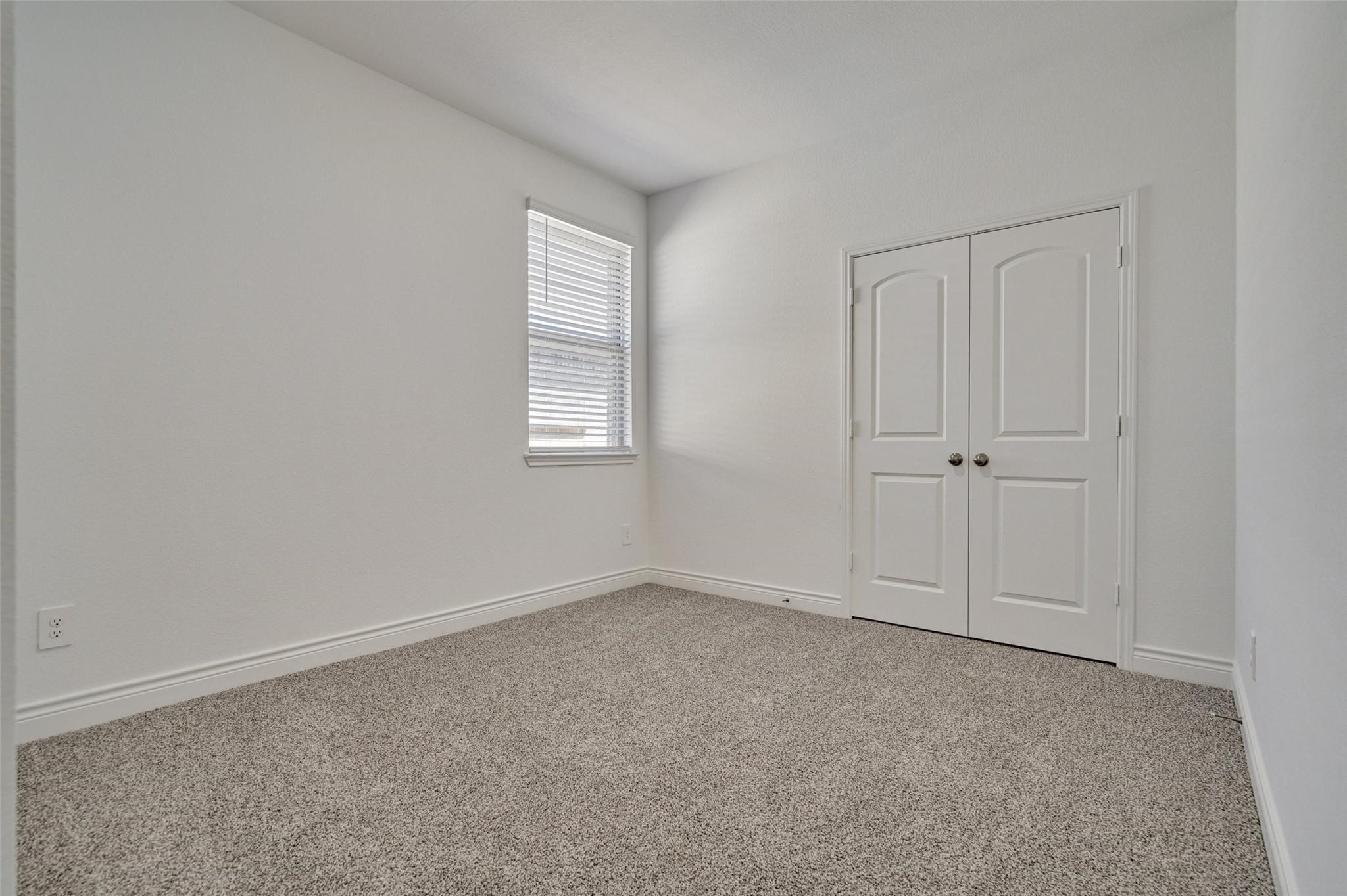 981 Youth Water Road Montgomery, TX 77316 - Photo 11 of 43 an empty room with windows