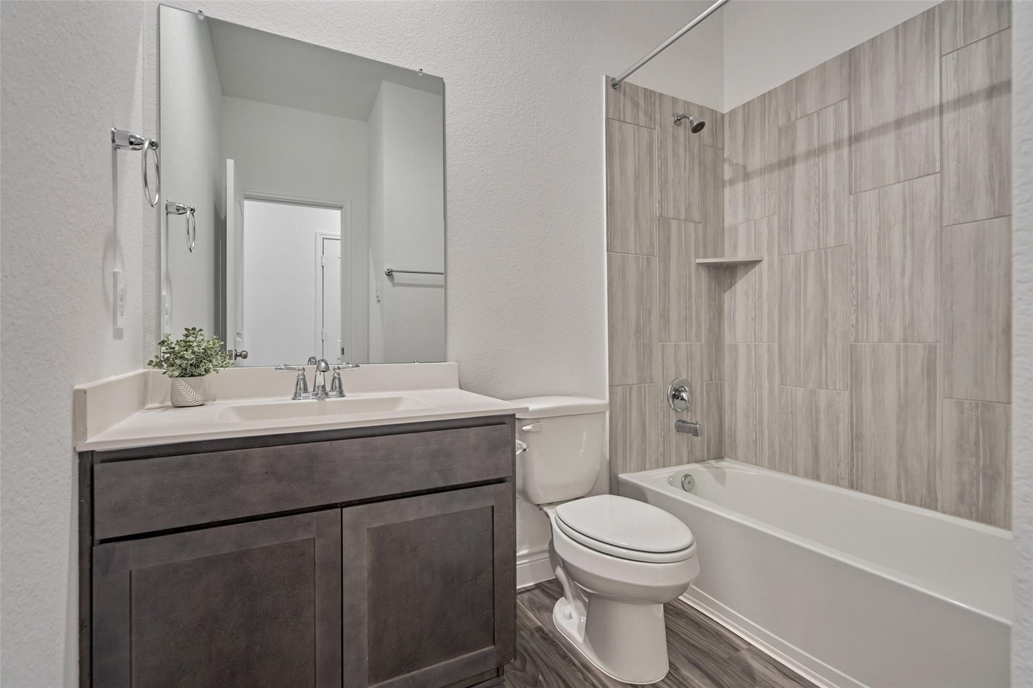 981 Youth Water Road Montgomery, TX 77316 - Photo 12 of 43 a bathroom with a sink a toilet and shower