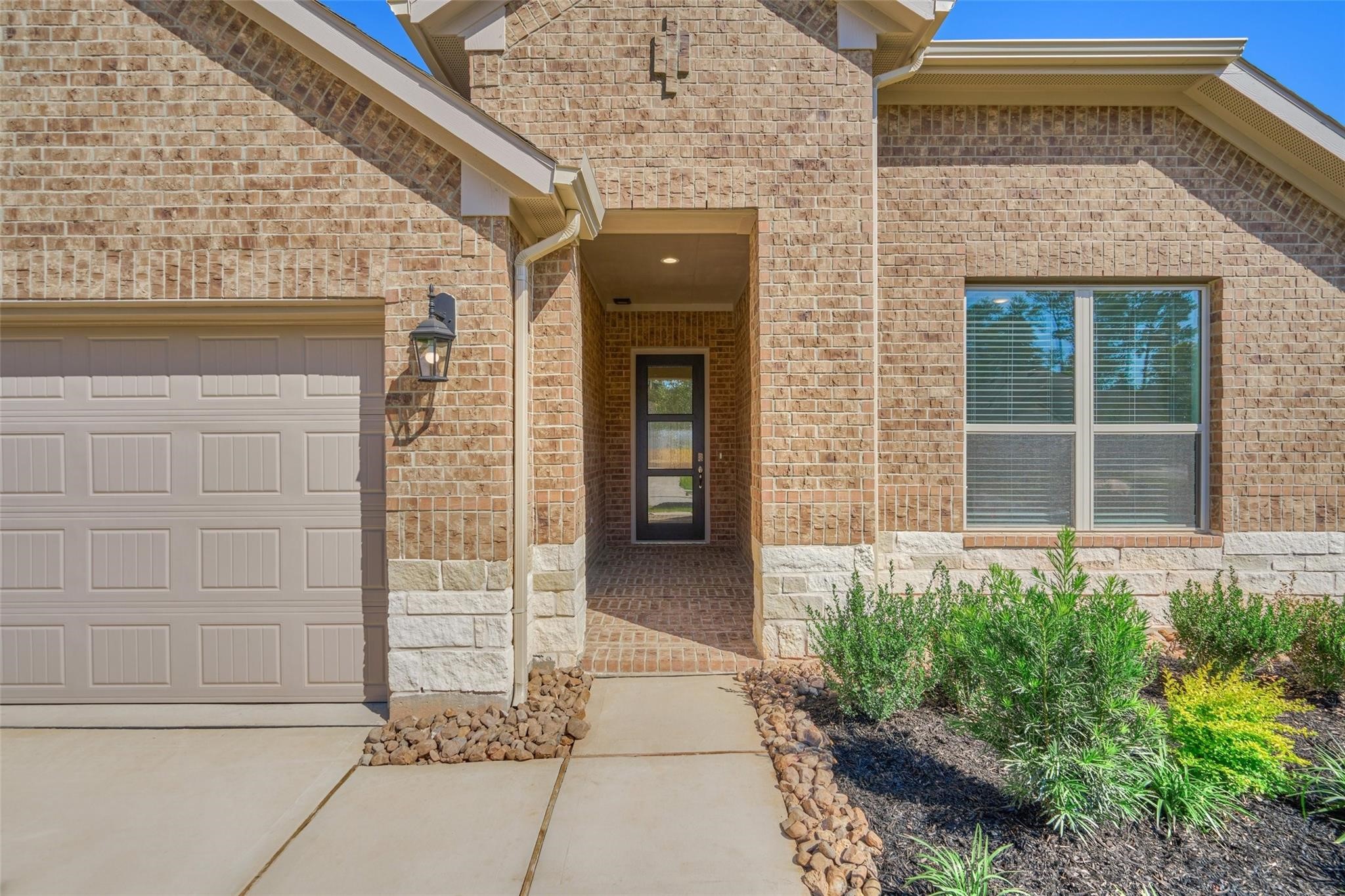 981 Youth Water Road Montgomery, TX 77316 - Photo 2 of 43 front view of a brick house with a large window
