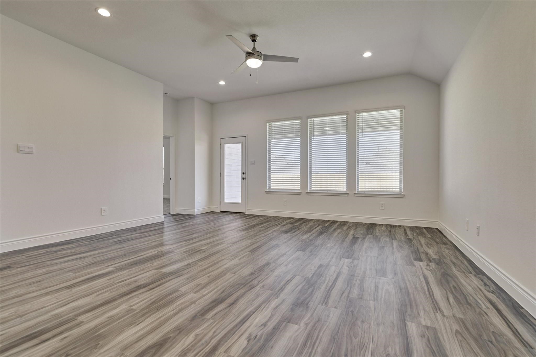 981 Youth Water Road Montgomery, TX 77316 - Photo 25 of 43 wooden floor in an empty room with a window