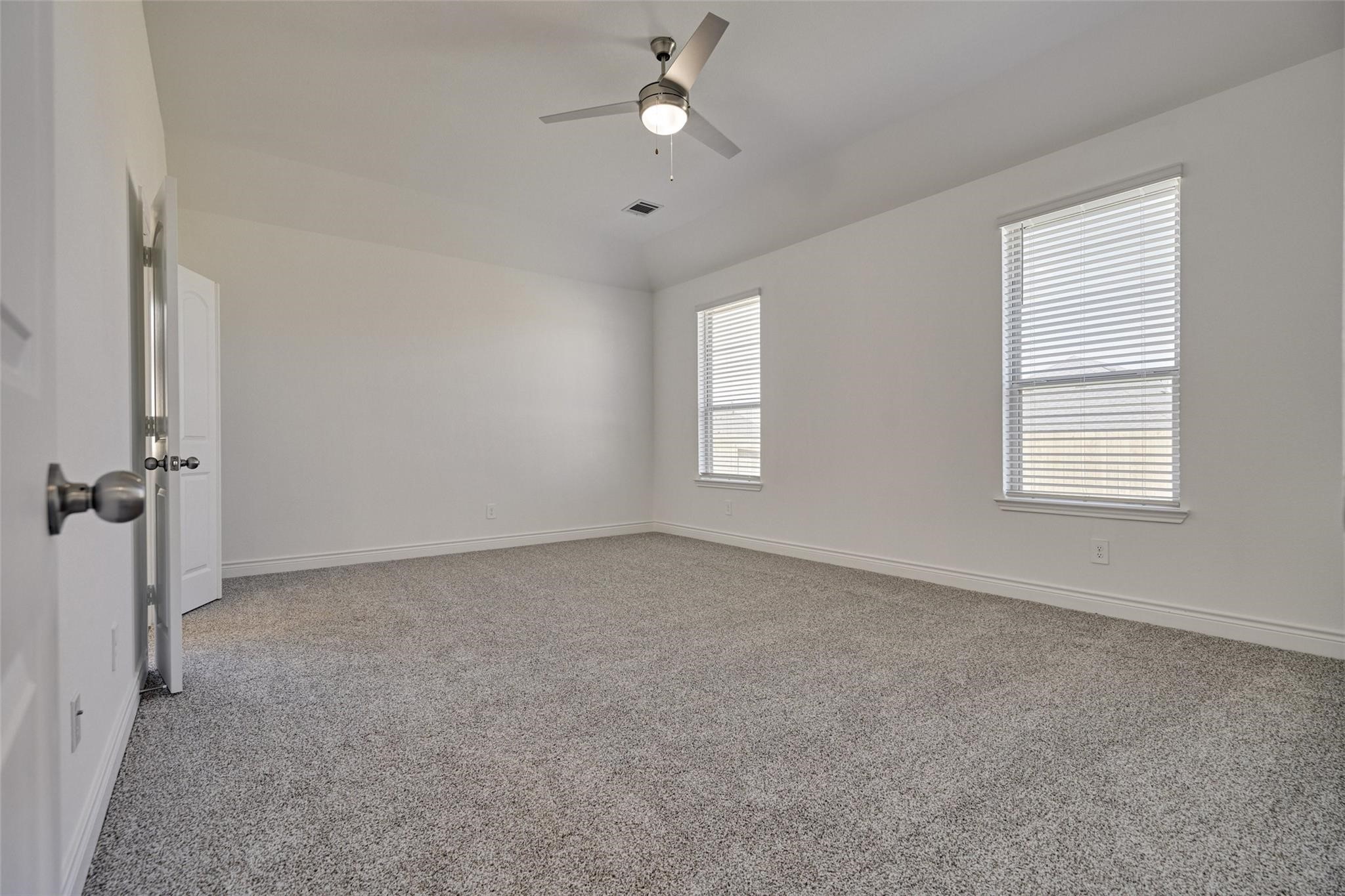 981 Youth Water Road Montgomery, TX 77316 - Photo 27 of 43 an empty room with windows and fan
