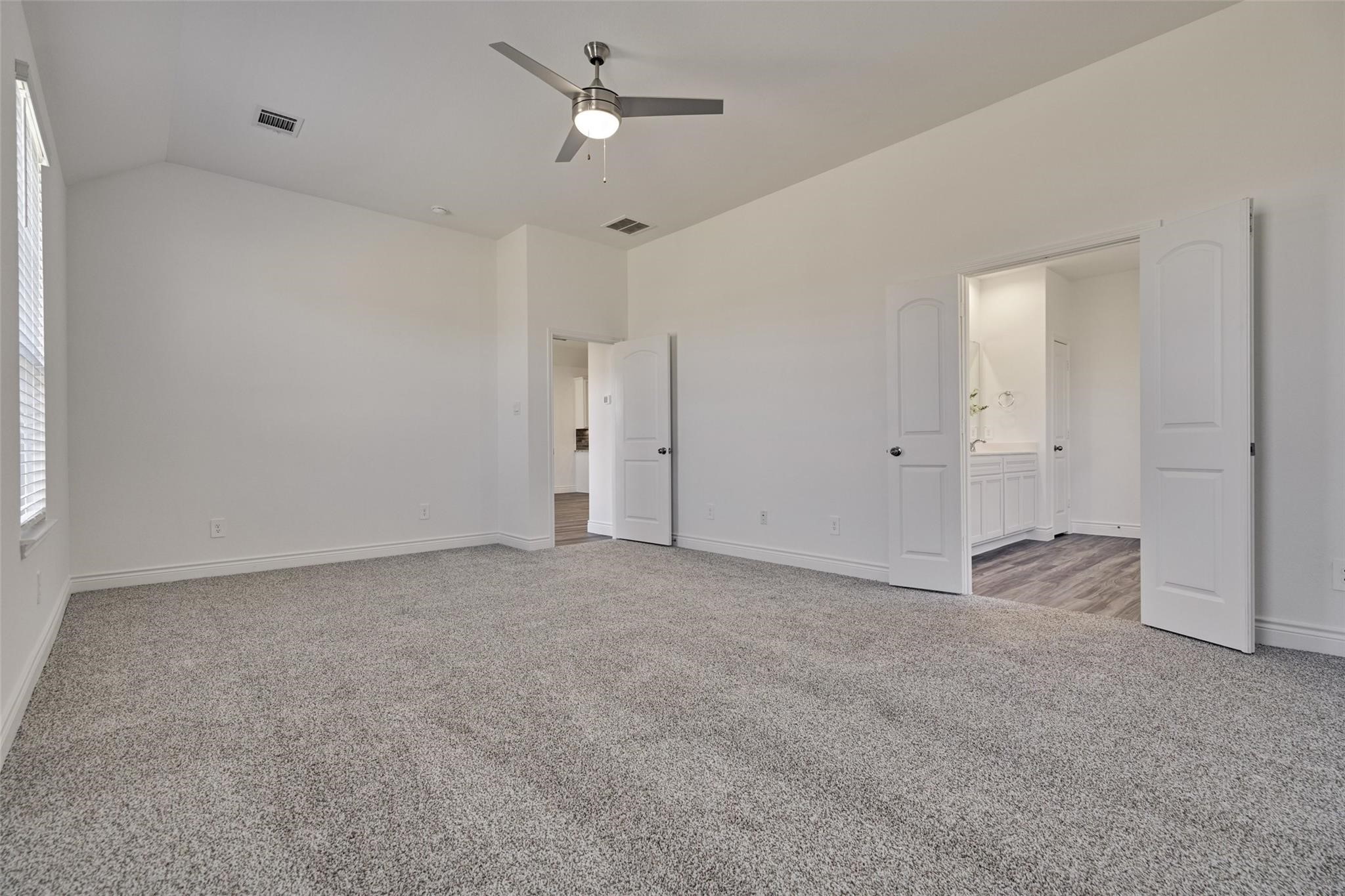 981 Youth Water Road Montgomery, TX 77316 - Photo 29 of 43 a view of an empty room with a ceiling fan