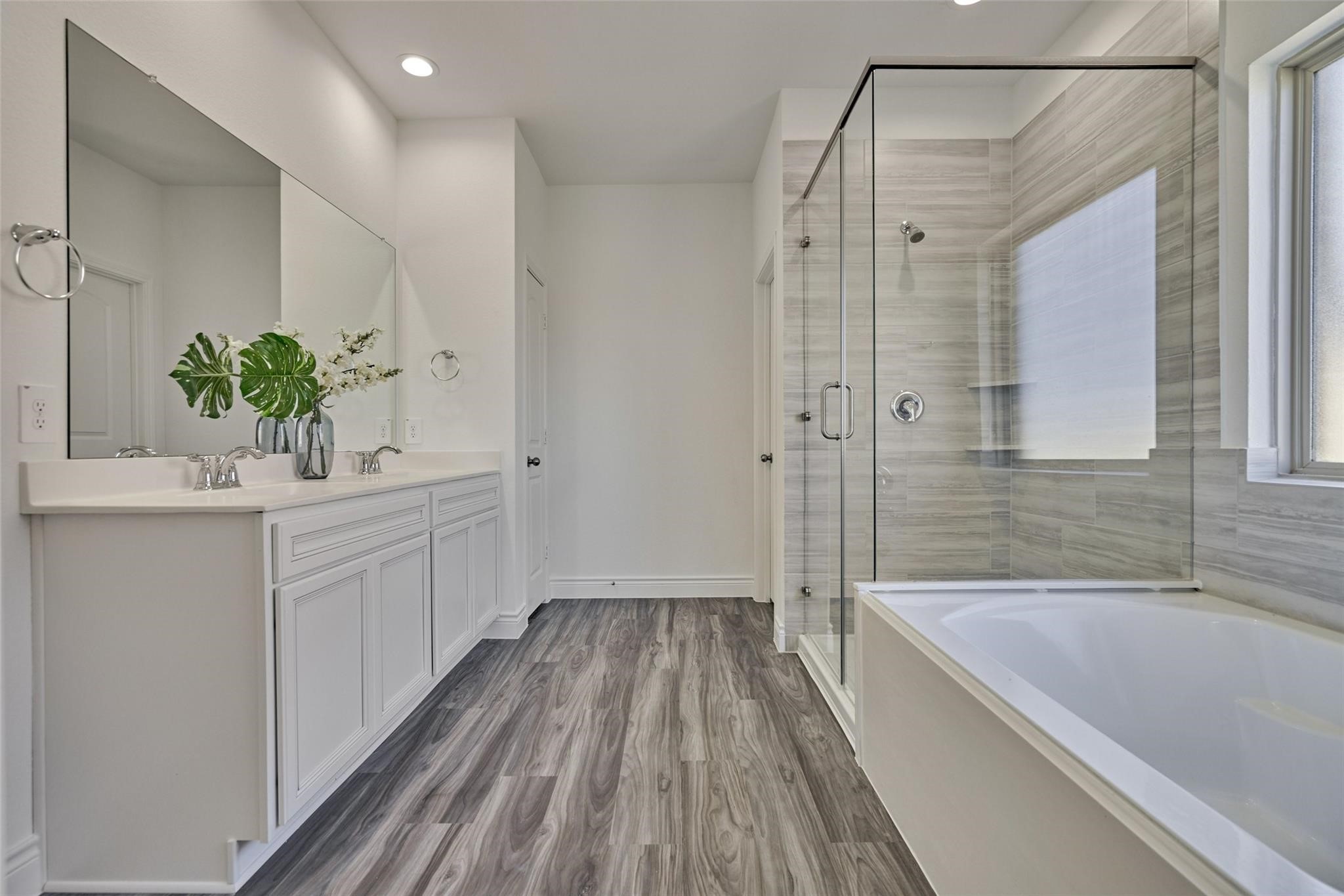 981 Youth Water Road Montgomery, TX 77316 - Photo 31 of 43 a bathroom with a sink a bathtub and a shower