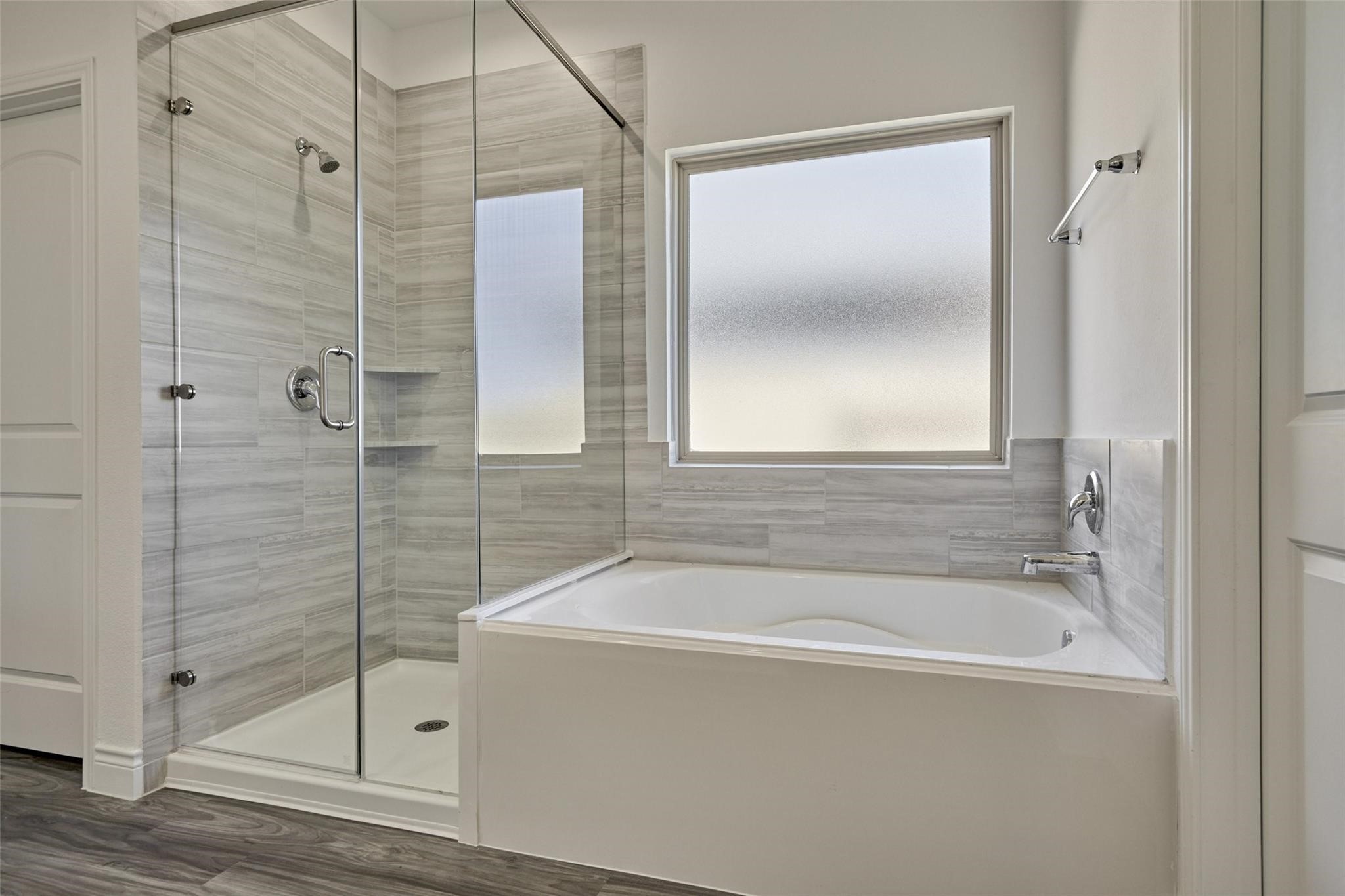 981 Youth Water Road Montgomery, TX 77316 - Photo 32 of 43 a white bath tub sitting next to a shower