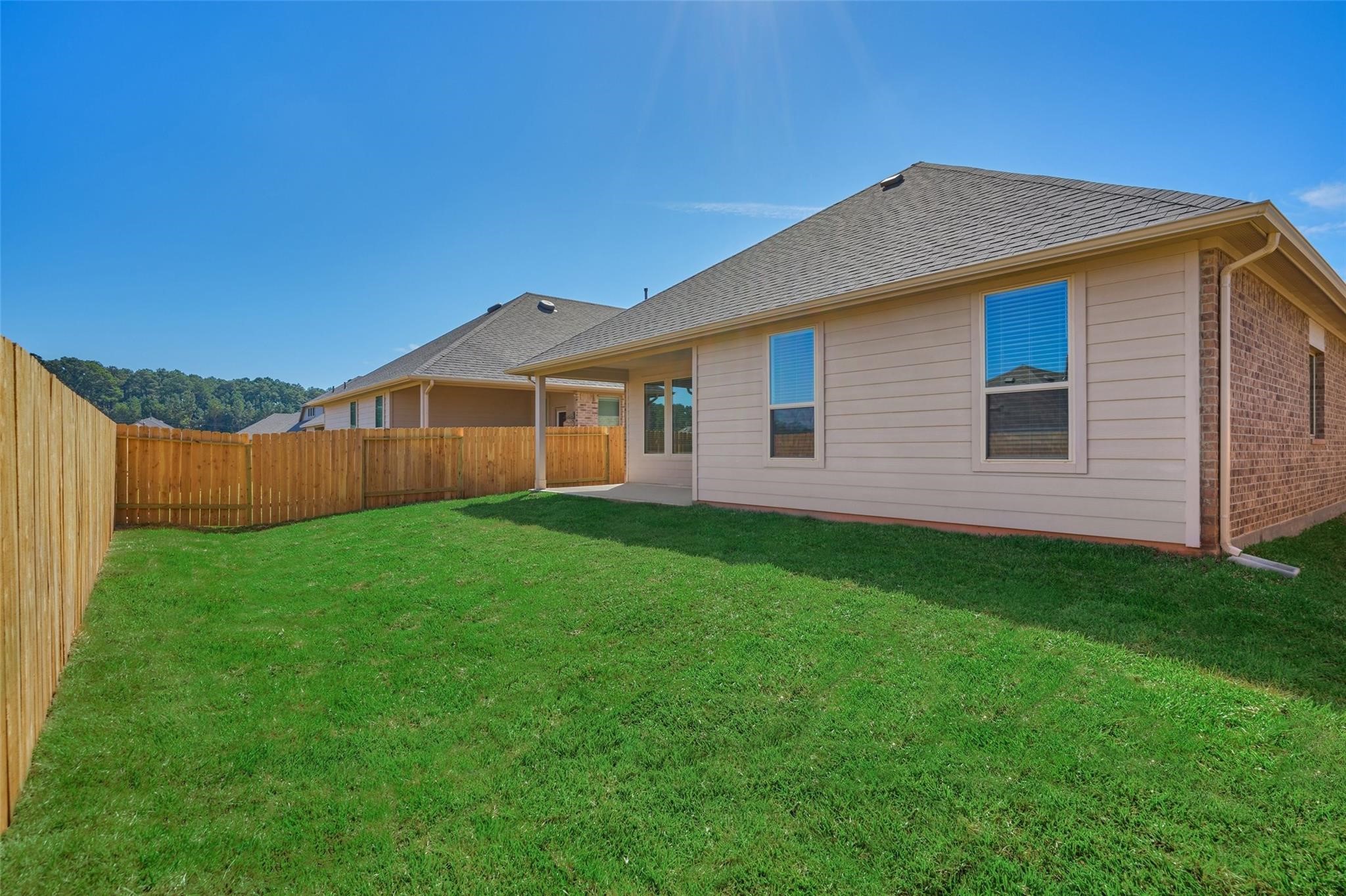 981 Youth Water Road Montgomery, TX 77316 - Photo 37 of 43 a view of a house with a yard