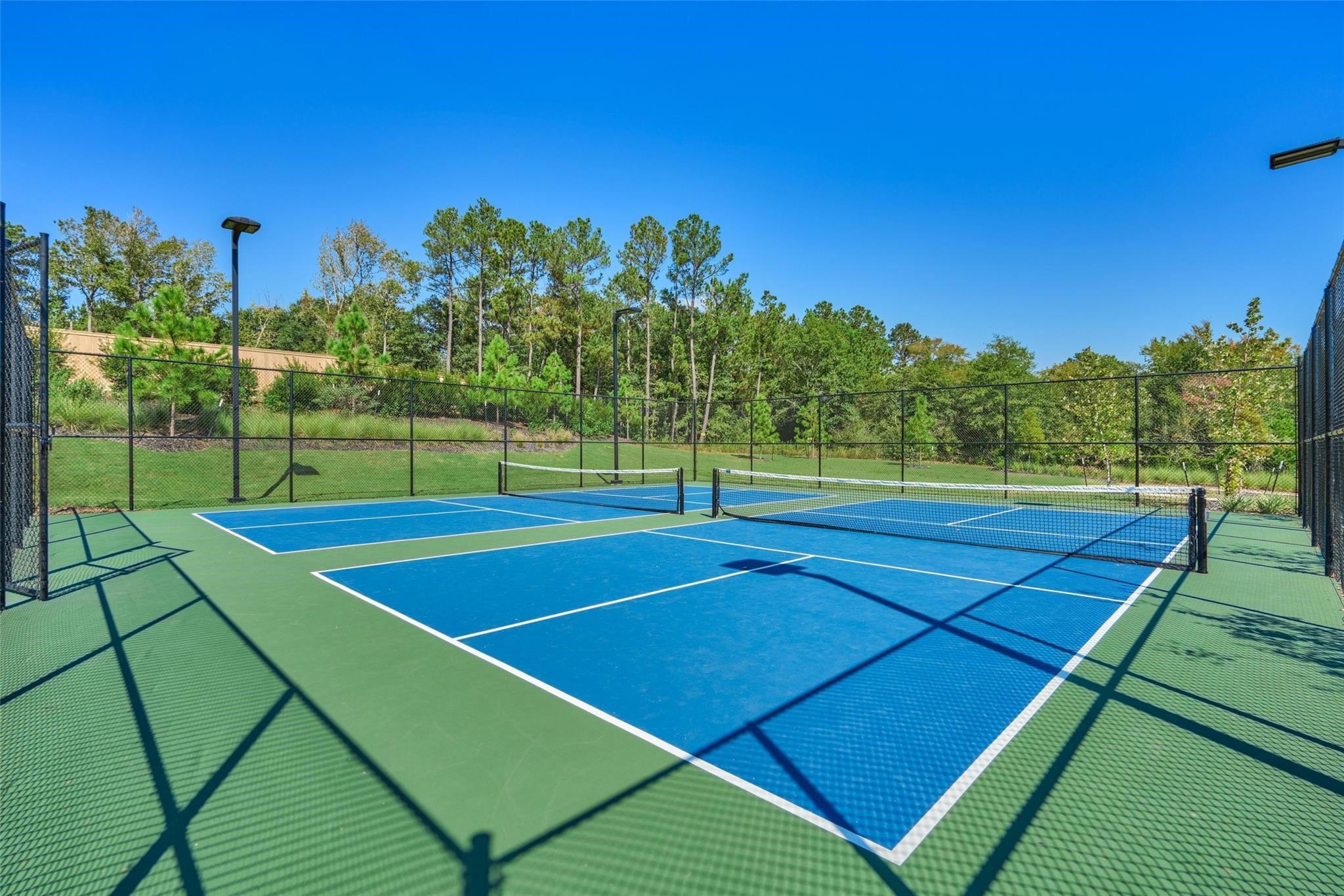 981 Youth Water Road Montgomery, TX 77316 - Photo 41 of 43 a tennis court that has tennis net