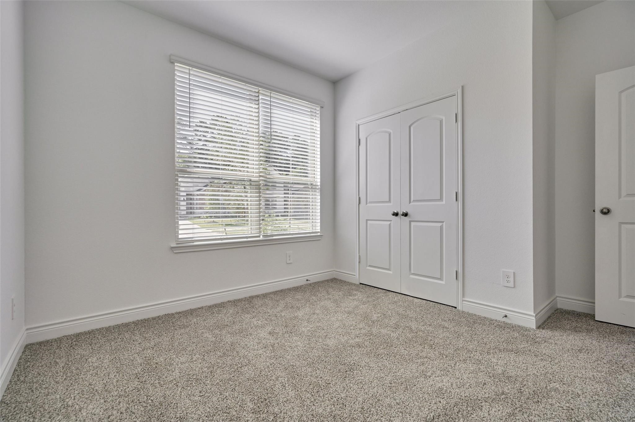981 Youth Water Road Montgomery, TX 77316 - Photo 5 of 43 an empty room with windows