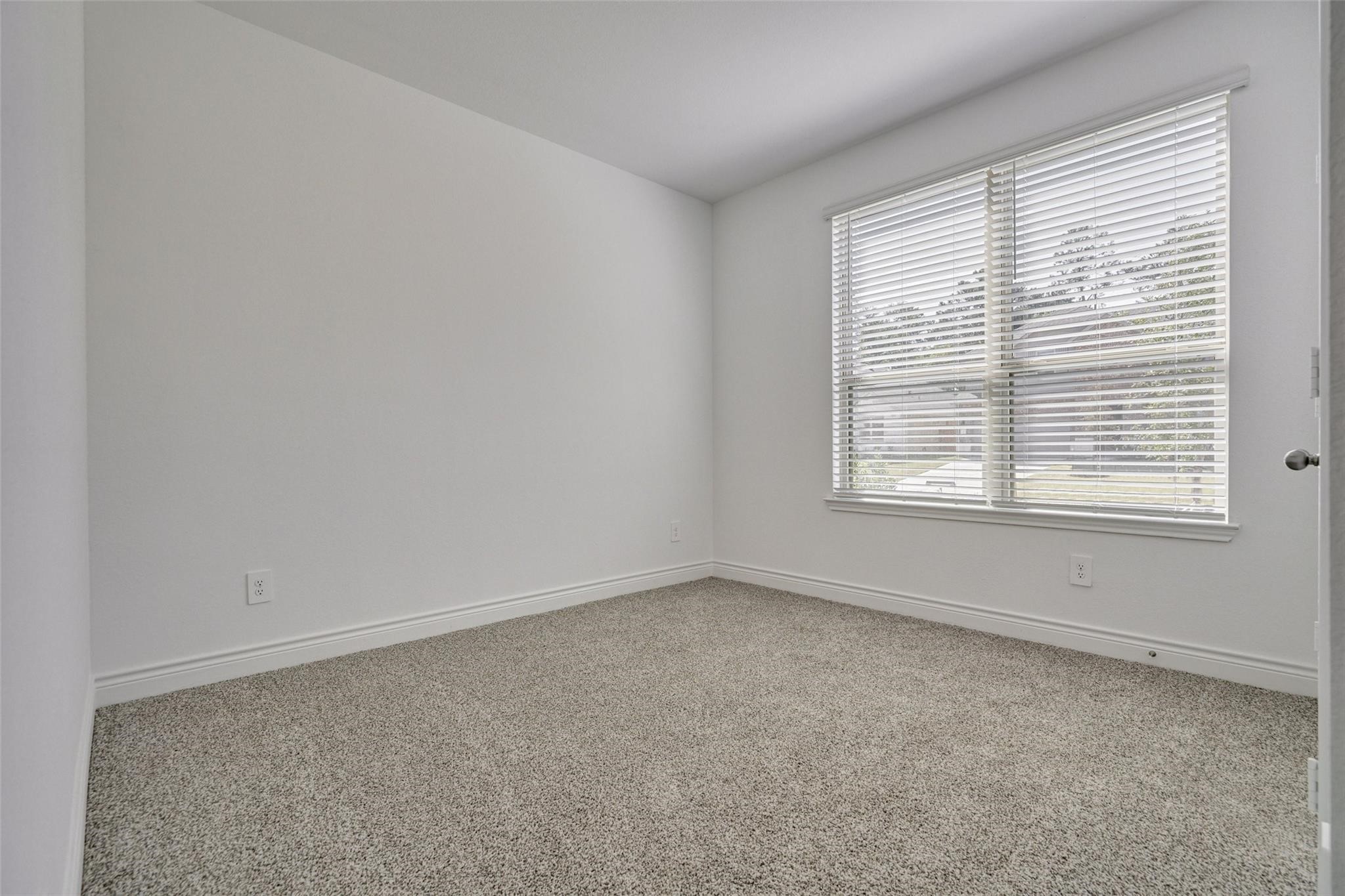 981 Youth Water Road Montgomery, TX 77316 - Photo 6 of 43 an empty room with a window