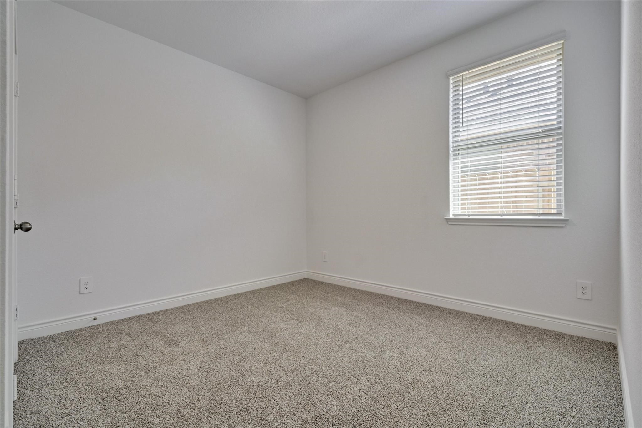 981 Youth Water Road Montgomery, TX 77316 - Photo 9 of 43 an empty room with a window