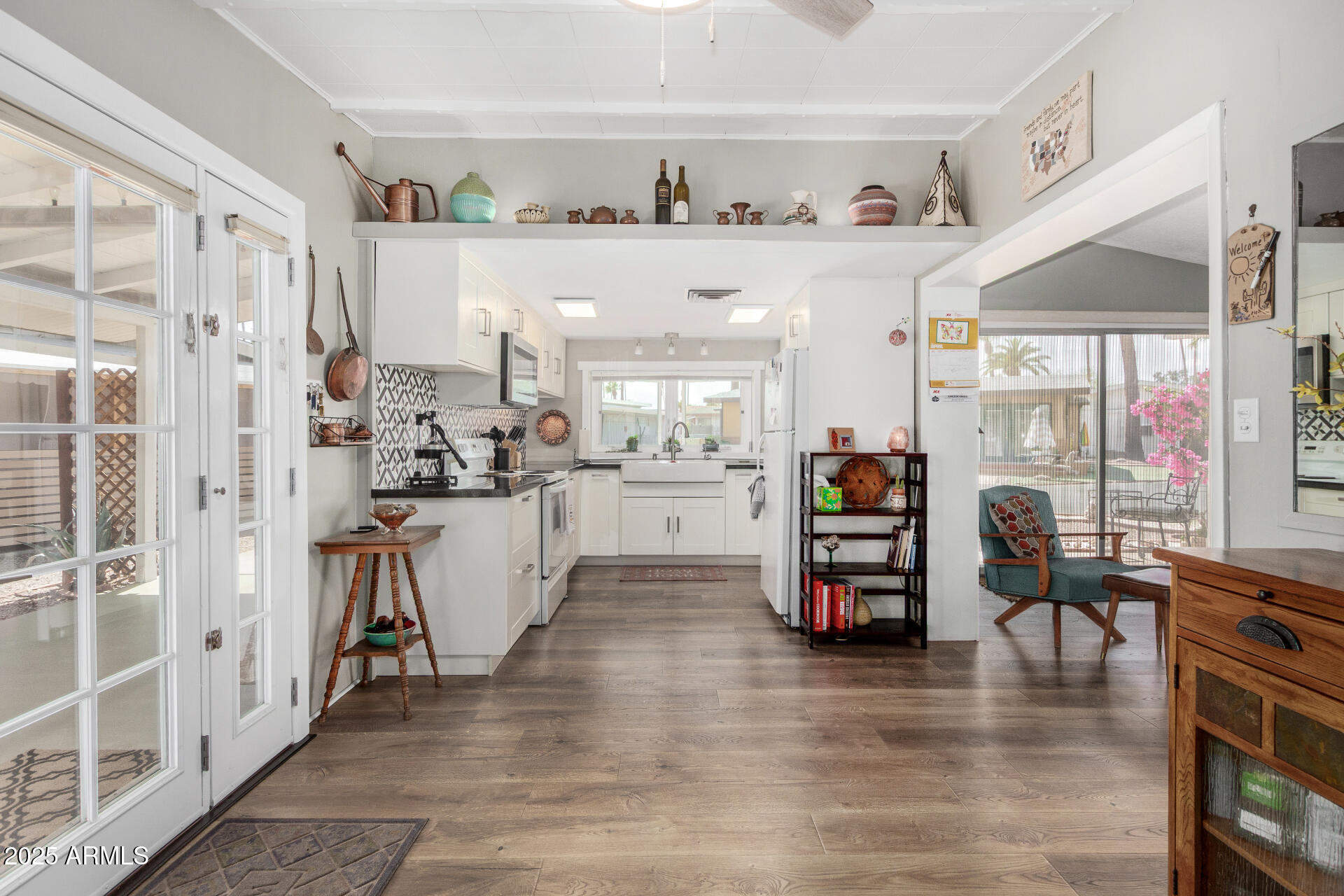 6700 East Thomas Road, Unit 71 Scottsdale, AZ 85251 - Photo 11 of 45 a kitchen with stainless steel appliances kitchen island granite countertop a refrigerator and cabinets