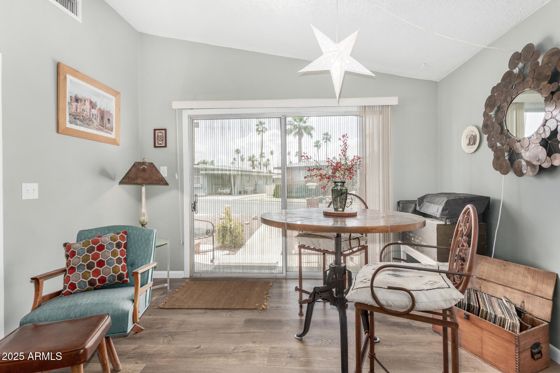 6700 East Thomas Road, Unit 71 Scottsdale, AZ 85251 - Photo 12 of 45 a view of a dining room with furniture and chandelier