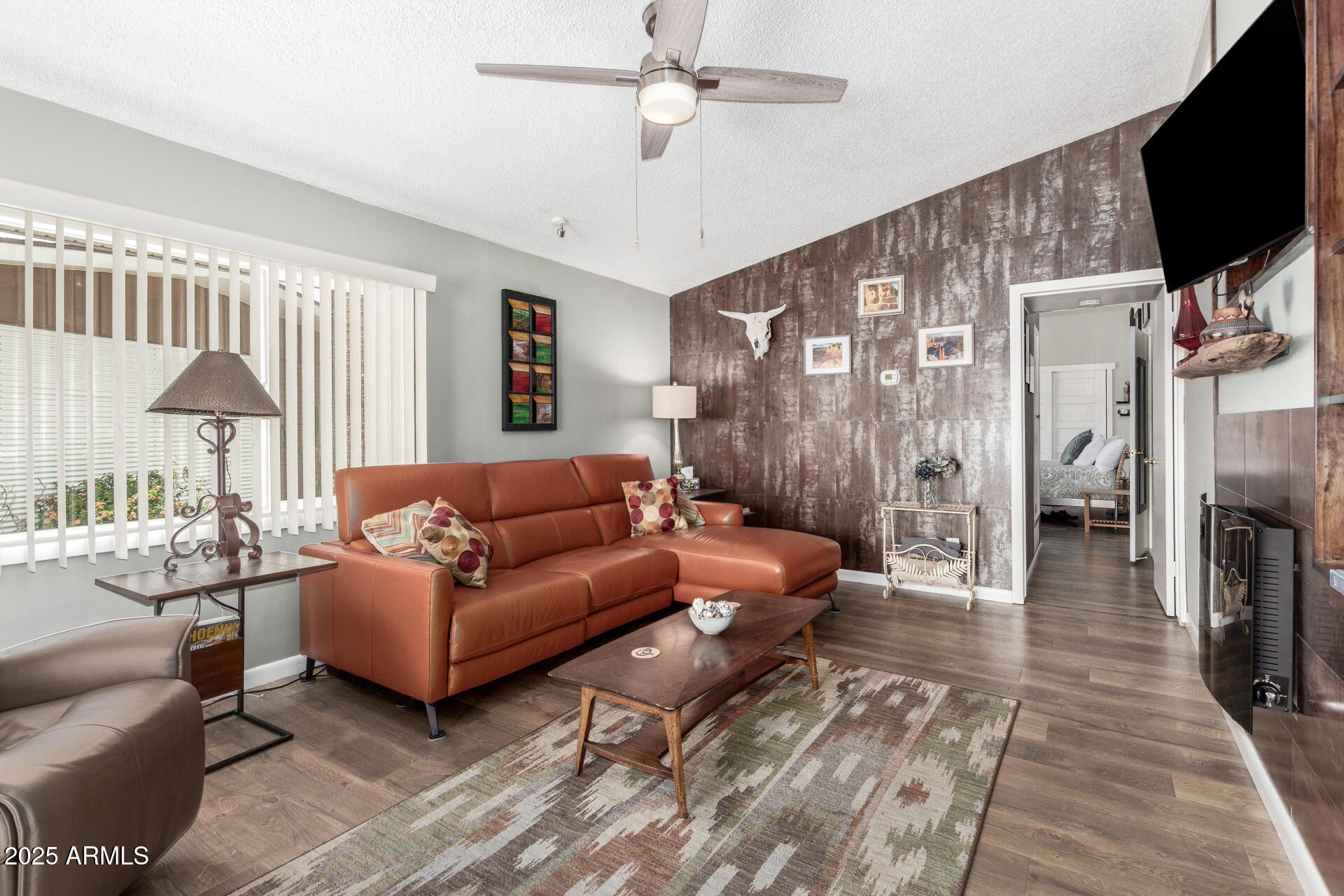 6700 East Thomas Road, Unit 71 Scottsdale, AZ 85251 - Photo 2 of 45 a living room with furniture a flat screen tv and a table