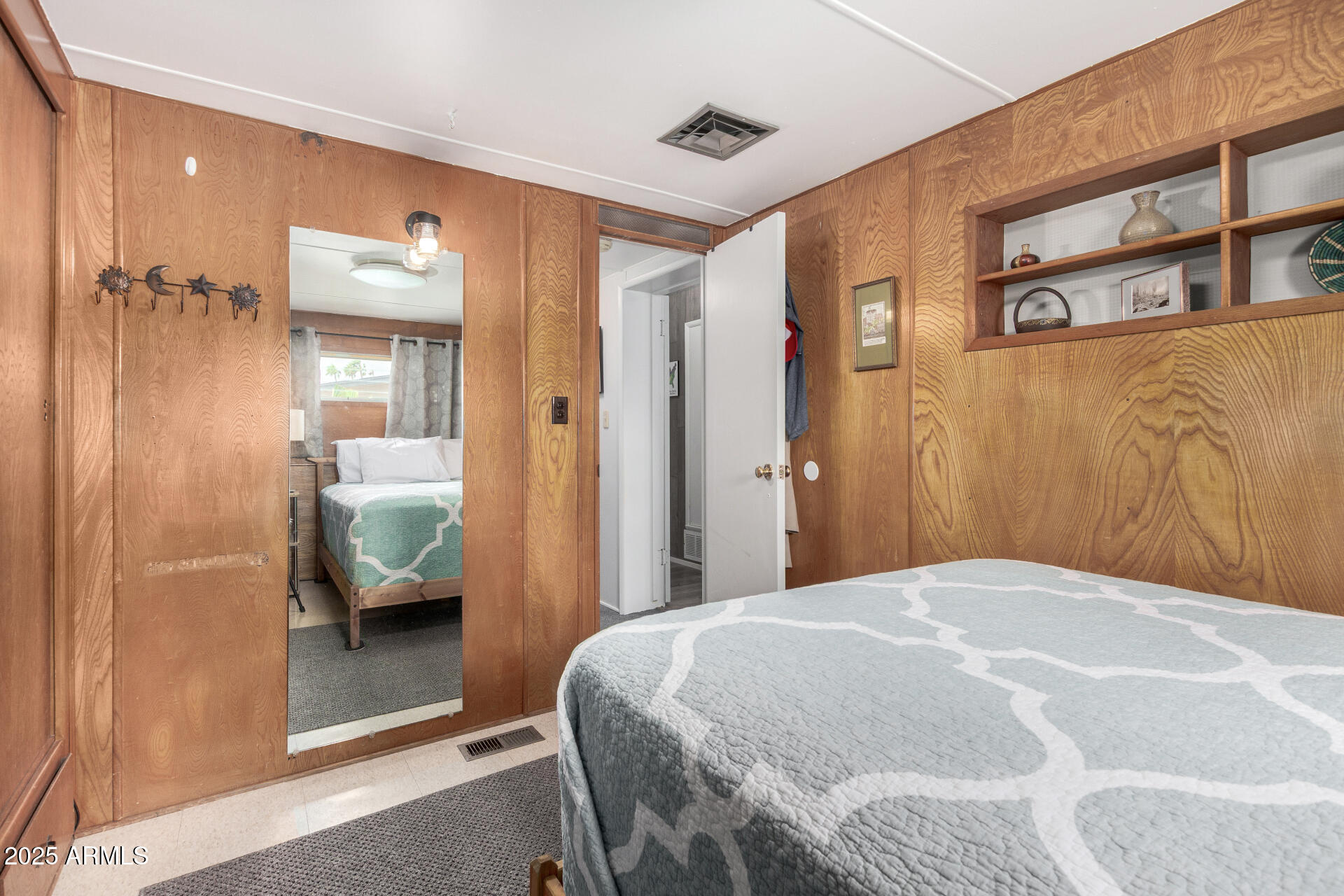 6700 East Thomas Road, Unit 71 Scottsdale, AZ 85251 - Photo 27 of 45 a bedroom with a bed and a couch