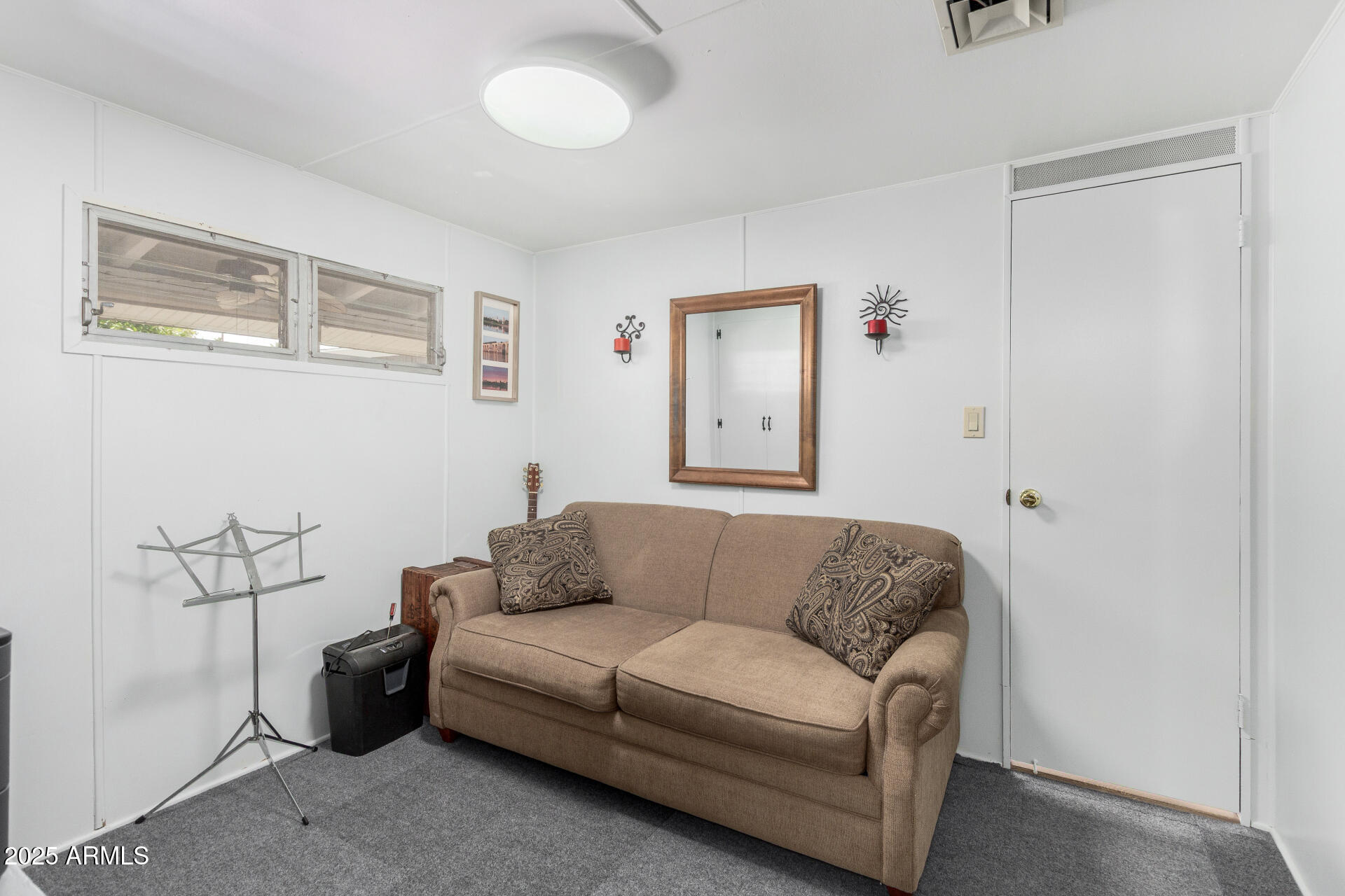 6700 East Thomas Road, Unit 71 Scottsdale, AZ 85251 - Photo 28 of 45 a living room with furniture and a walk in closet