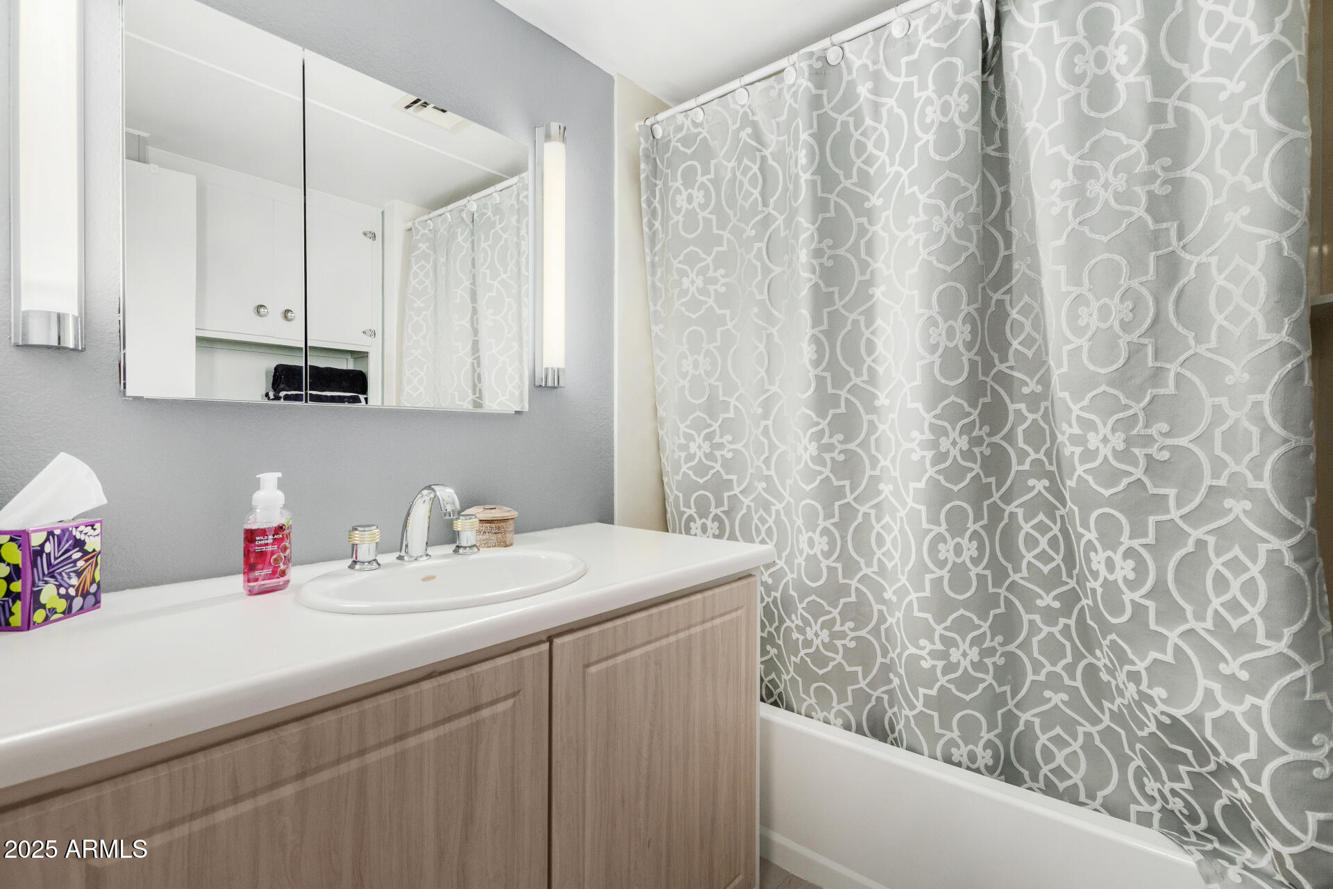 6700 East Thomas Road, Unit 71 Scottsdale, AZ 85251 - Photo 30 of 45 a bathroom with a sink and a mirror