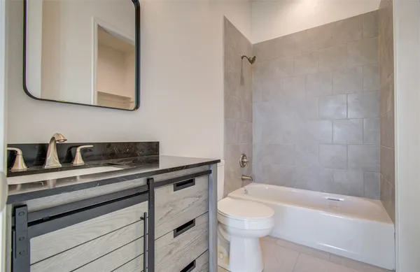 a bathroom with a sink a toilet and a bathtub