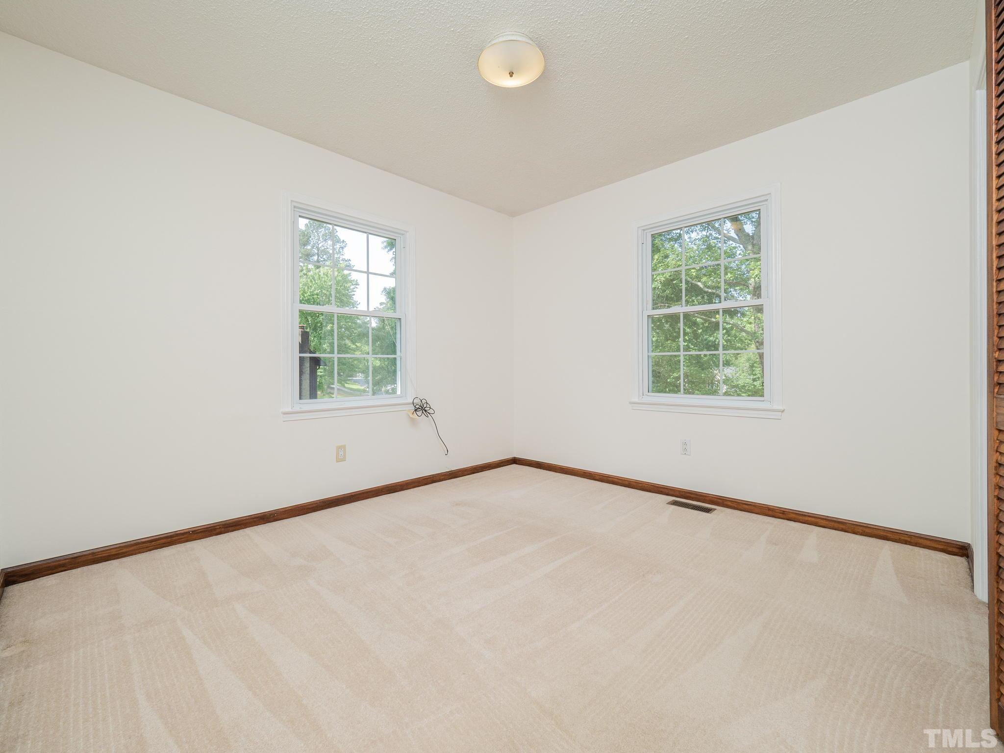 4504 Waterbury Road Raleigh, NC 27604 - Photo 15 of 38 an empty room with a window
