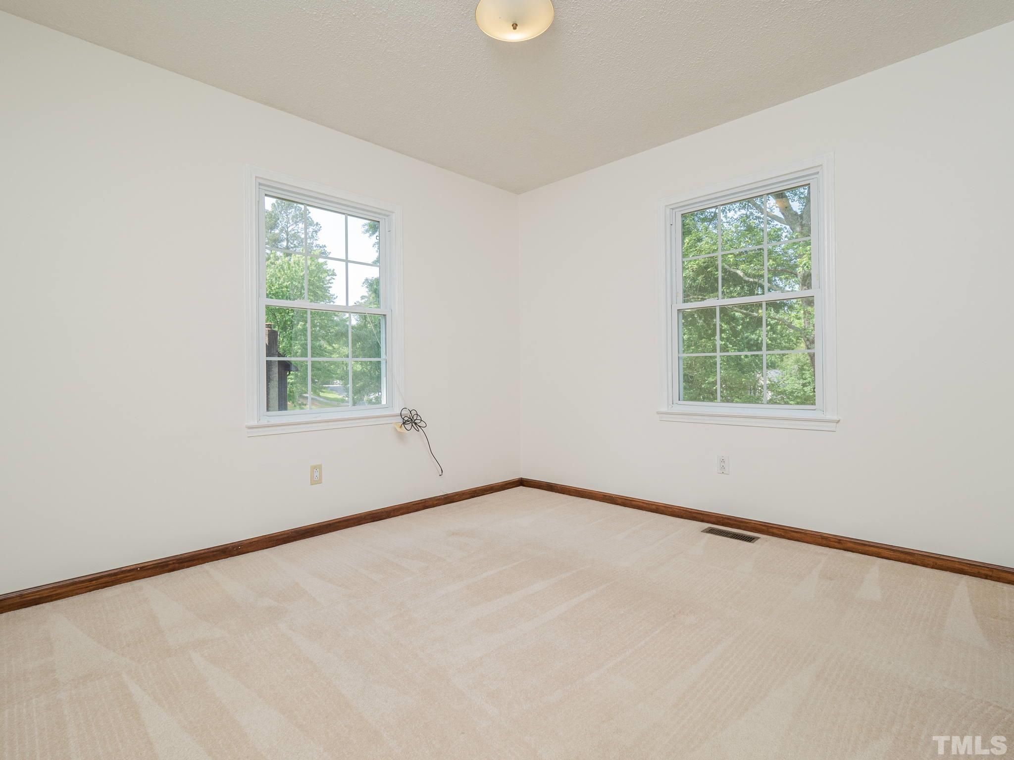 4504 Waterbury Road Raleigh, NC 27604 - Photo 16 of 38 an empty room with a window