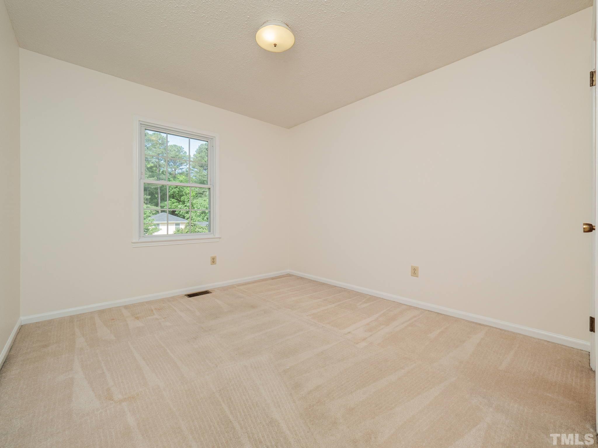 4504 Waterbury Road Raleigh, NC 27604 - Photo 17 of 38 an empty room with a window