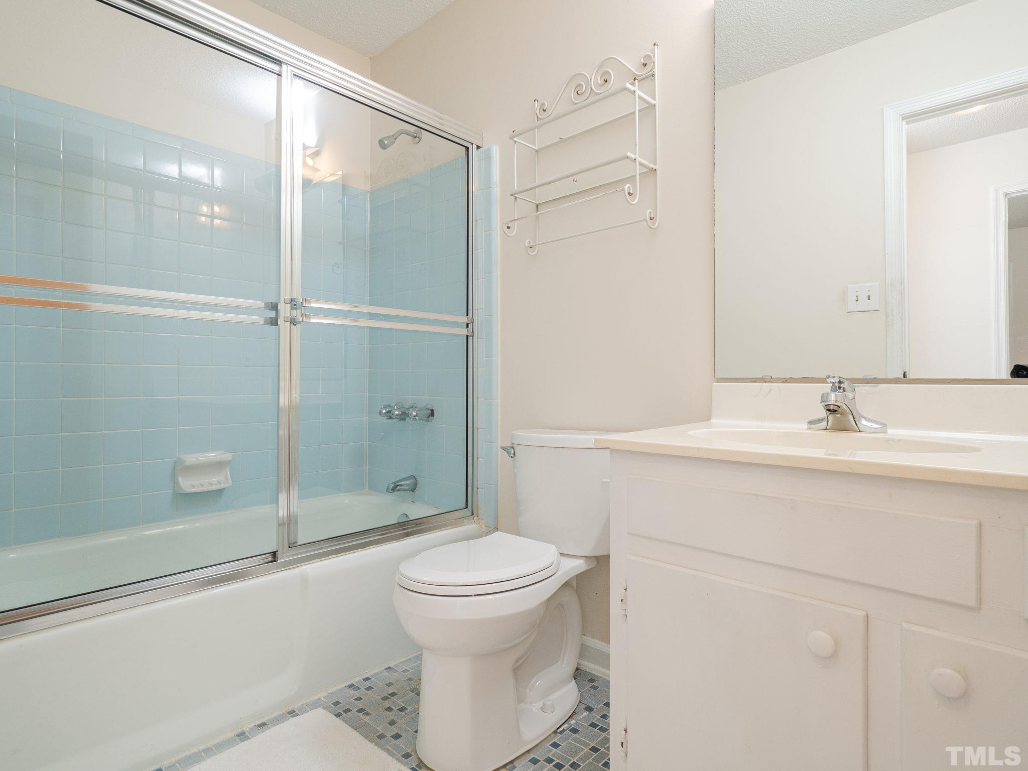 4504 Waterbury Road Raleigh, NC 27604 - Photo 19 of 38 a bathroom with a sink toilet and shower