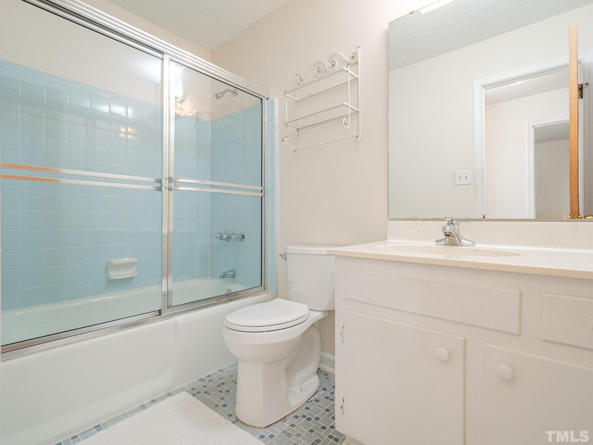 4504 Waterbury Road Raleigh, NC 27604 - Photo 20 of 38 a bathroom with a sink toilet and shower