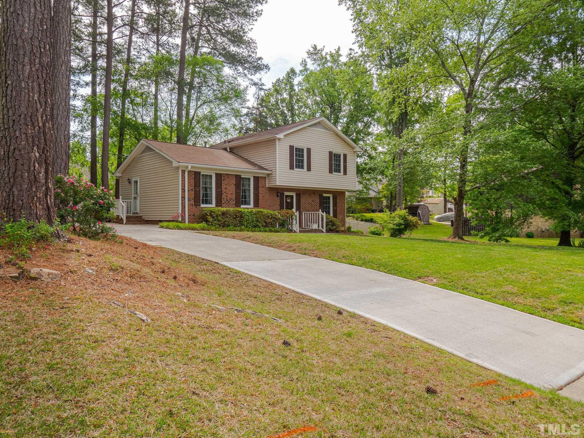 4504 Waterbury Road Raleigh, NC 27604 - Photo 2 of 38 a front view of a house with garden