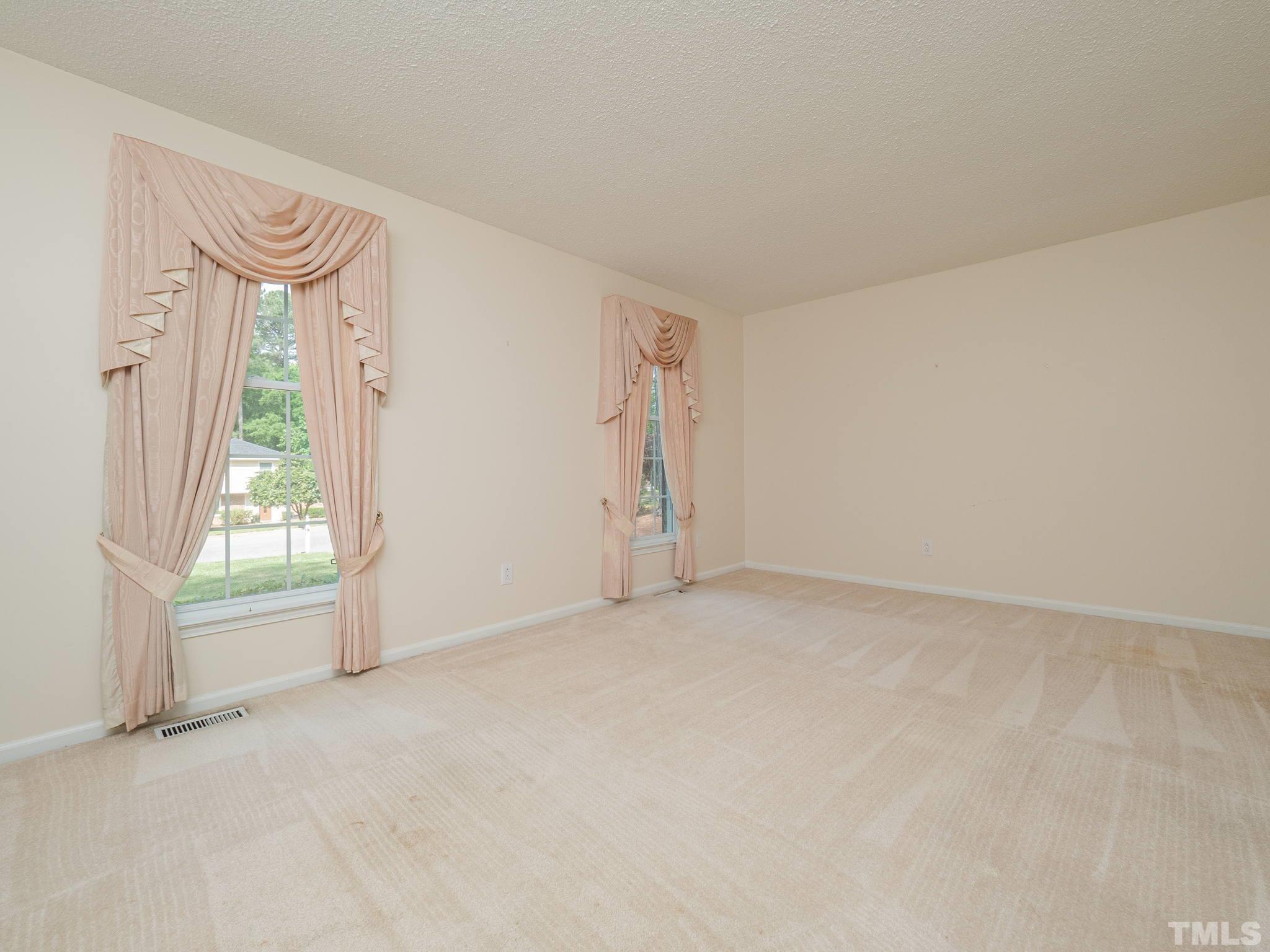 4504 Waterbury Road Raleigh, NC 27604 - Photo 21 of 38 an empty room with a window