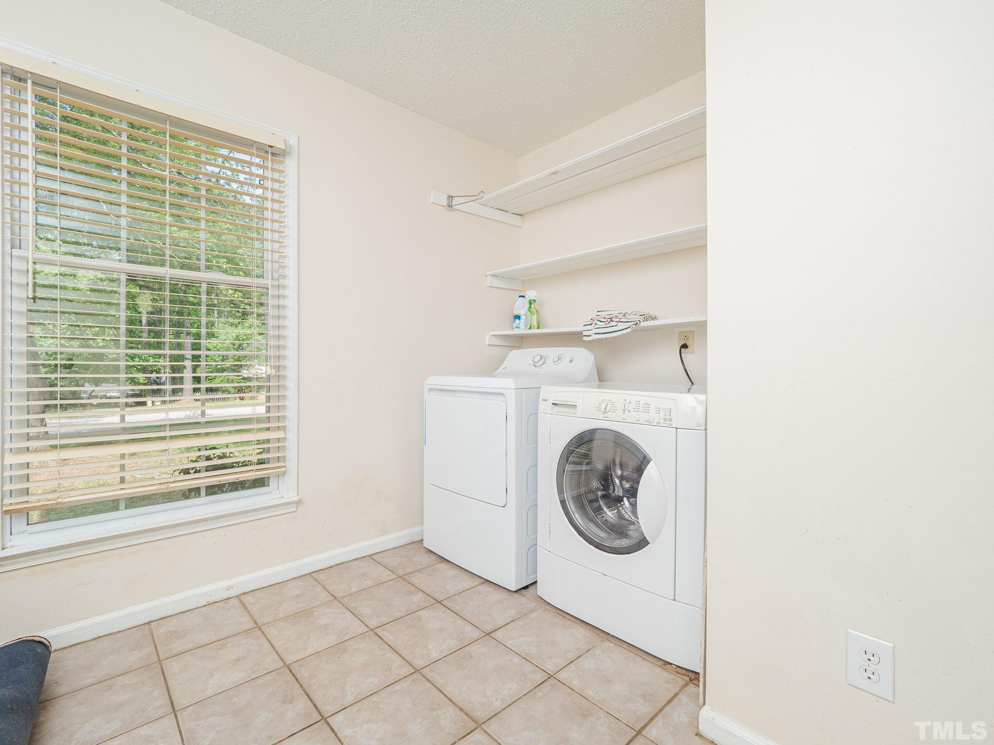 4504 Waterbury Road Raleigh, NC 27604 - Photo 30 of 38 a utility room with dryer and washer