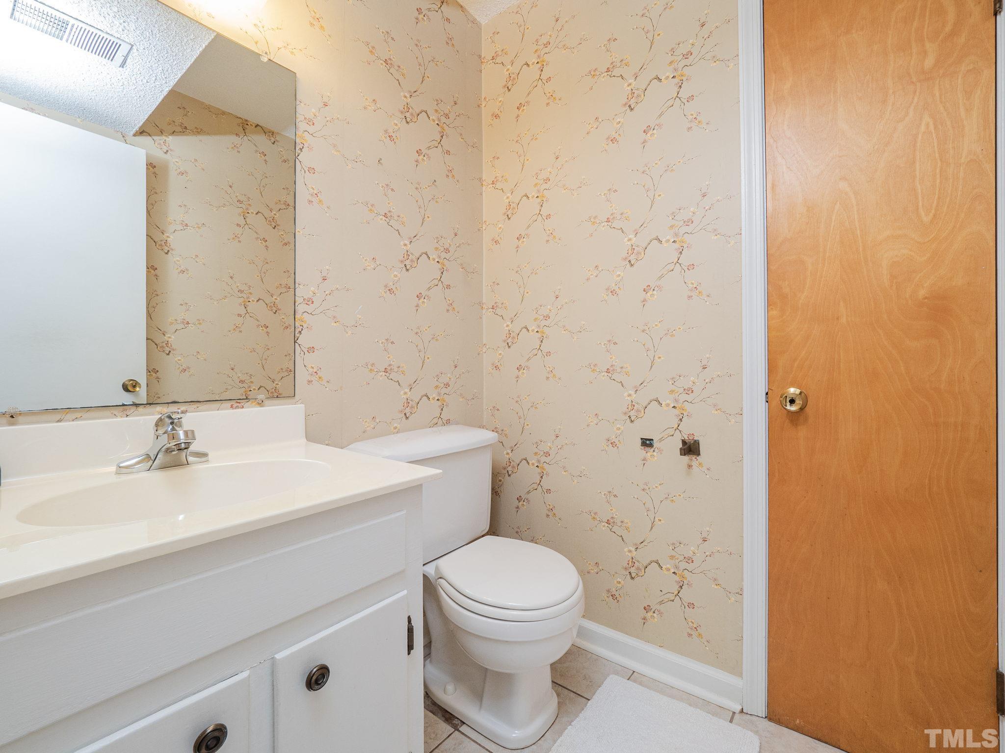 4504 Waterbury Road Raleigh, NC 27604 - Photo 31 of 38 a bathroom with a sink a toilet and shower