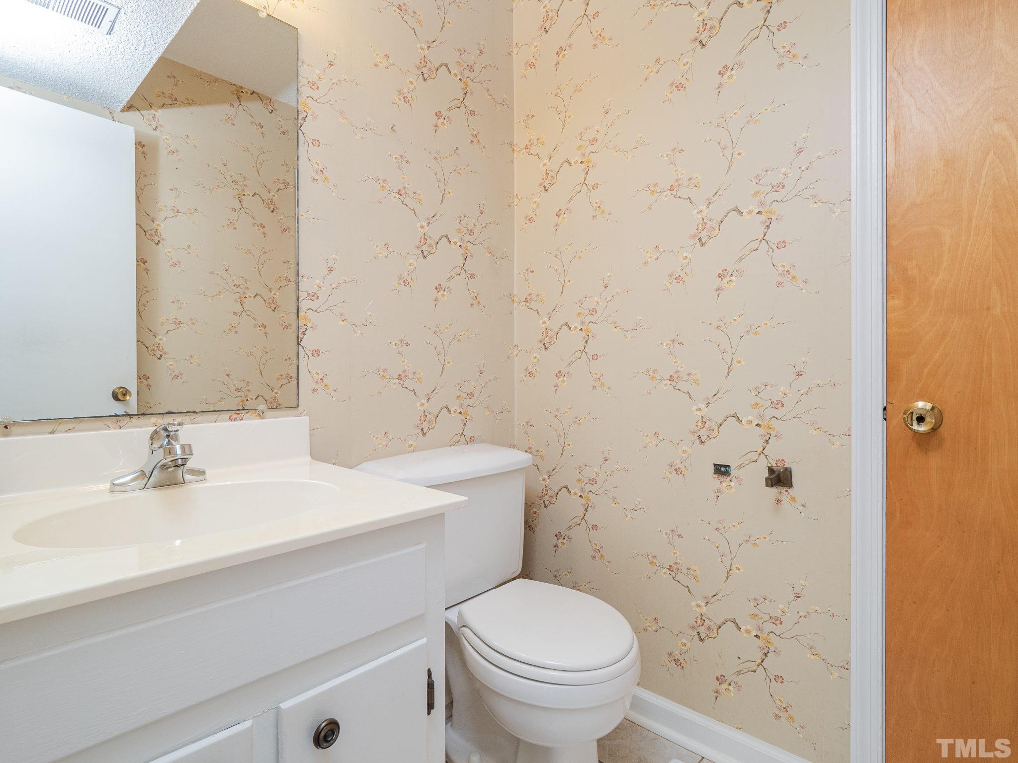 4504 Waterbury Road Raleigh, NC 27604 - Photo 32 of 38 a bathroom with a sink a toilet and shower