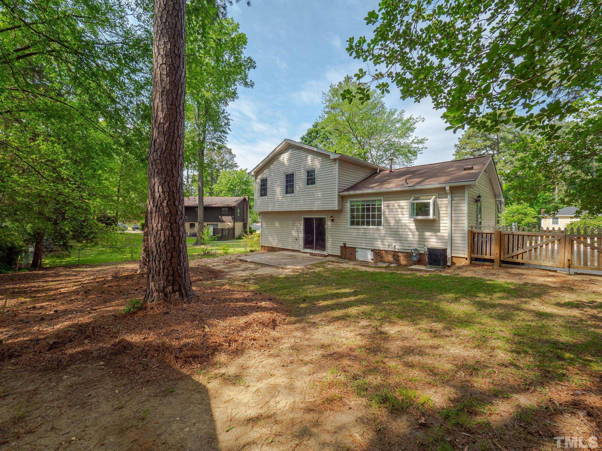 4504 Waterbury Road Raleigh, NC 27604 - Photo 38 of 38 a front view of a house with a garden