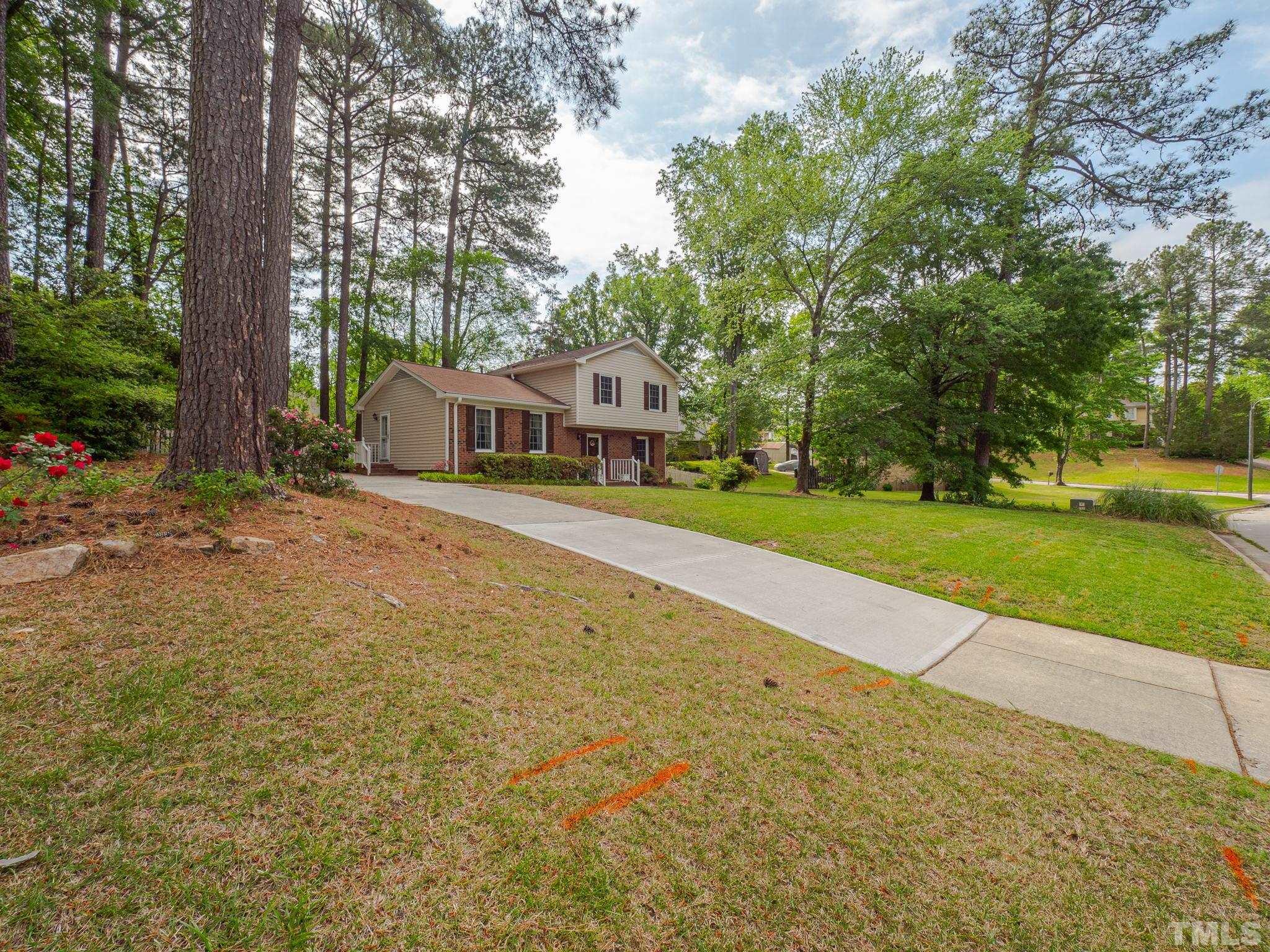 4504 Waterbury Road Raleigh, NC 27604 - Photo 6 of 38 a front view of a house with a yard