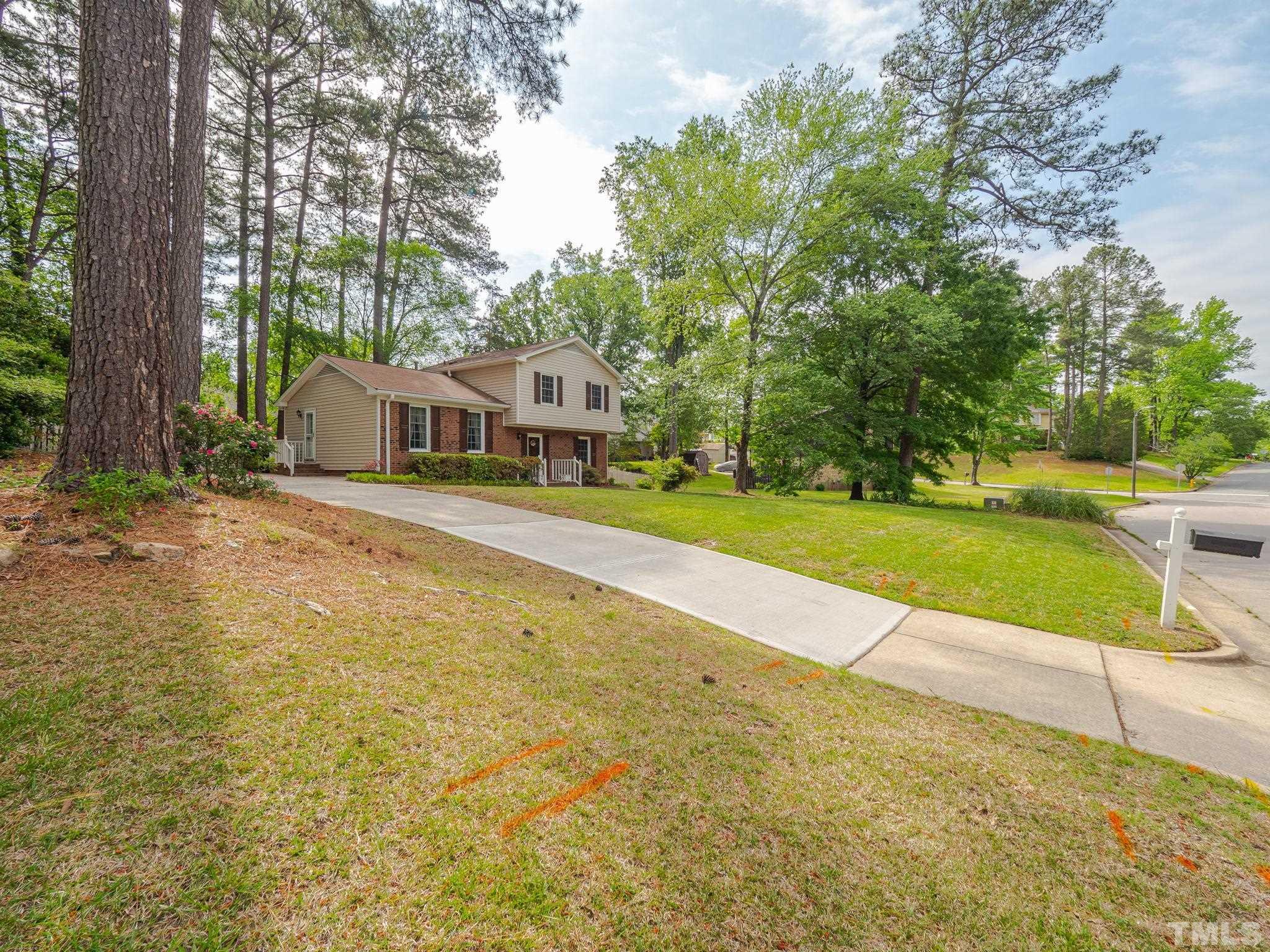 4504 Waterbury Road Raleigh, NC 27604 - Photo 7 of 38 a view of a swimming pool with a patio and a yard