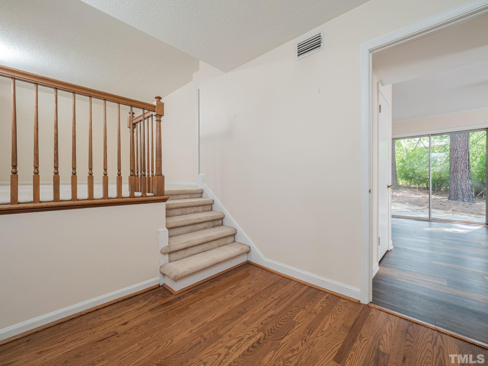 4504 Waterbury Road Raleigh, NC 27604 - Photo 9 of 38 a view of entryway with wooden floor