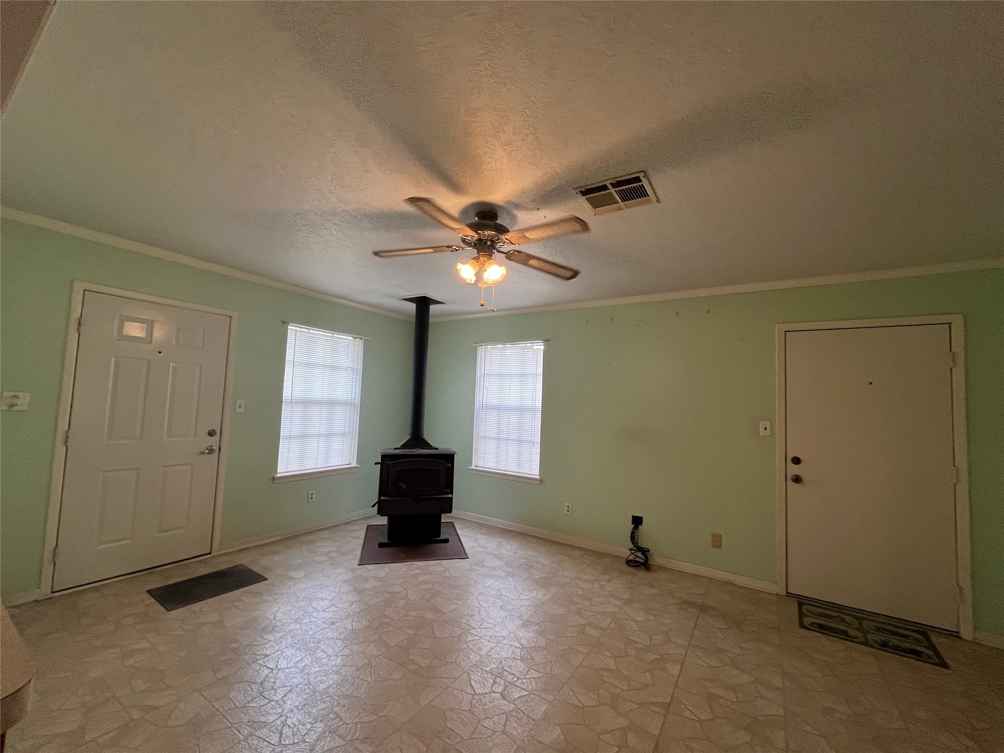 1475 Cr 16 Road Garwood, TX 77442 - Photo 23 of 43 a view of a livingroom with a ceiling fan and window