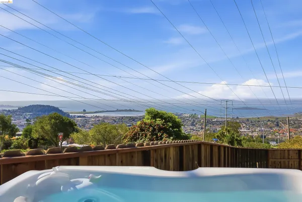 a view of a balcony with furniture
