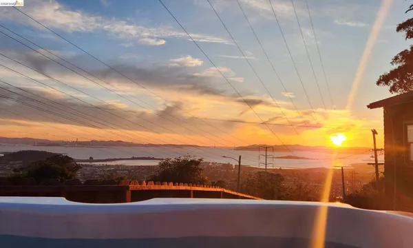 a kitchen with white cabinets and appliances