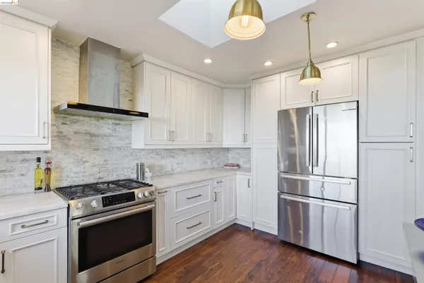 a bedroom with a large bed and a couch