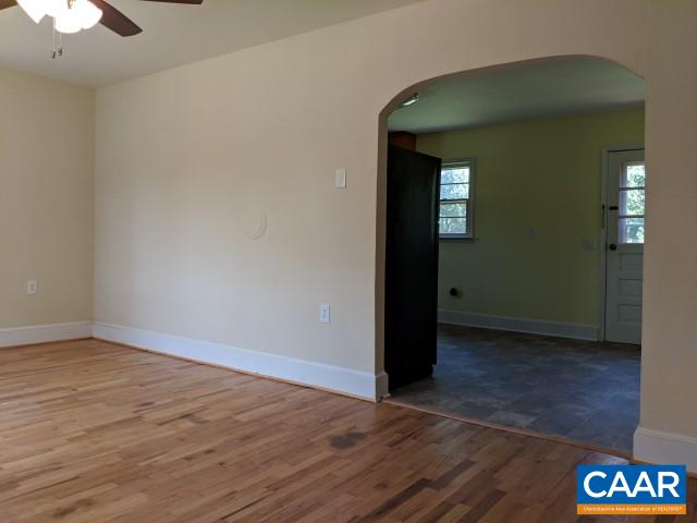243 Resettlement Road Madison, VA 22727 - Photo 5 of 18 an empty room with wooden floor and windows