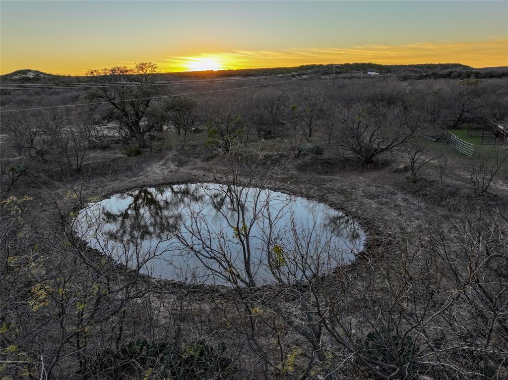 322 County Road 494 Novice, TX 79538 - Photo 21 of 35 a view of a backyard with mountain and mountains