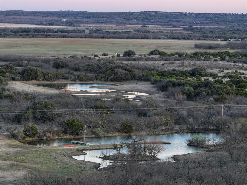 322 County Road 494 Novice, TX 79538 - Photo 22 of 35 a view of a lake with a mountain