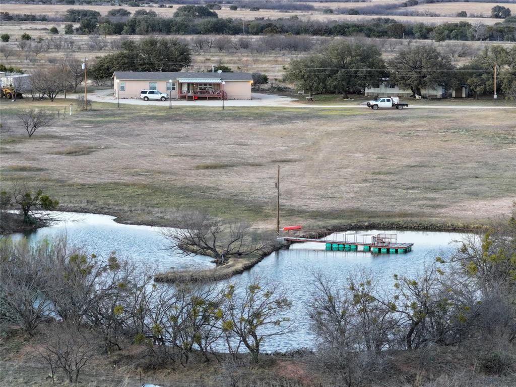 322 County Road 494 Novice, TX 79538 - Photo 23 of 35 a view of car parked on road with trees