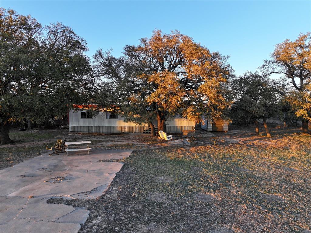 322 County Road 494 Novice, TX 79538 - Photo 34 of 35 a backyard of a house with fire pit and outdoor seating