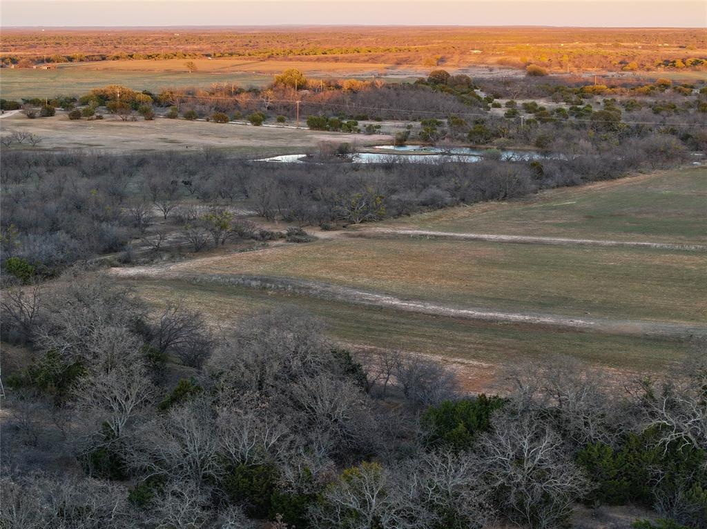 322 County Road 494 Novice, TX 79538 - Photo 10 of 35 an aerial view of residential houses with outdoor space and ocean view